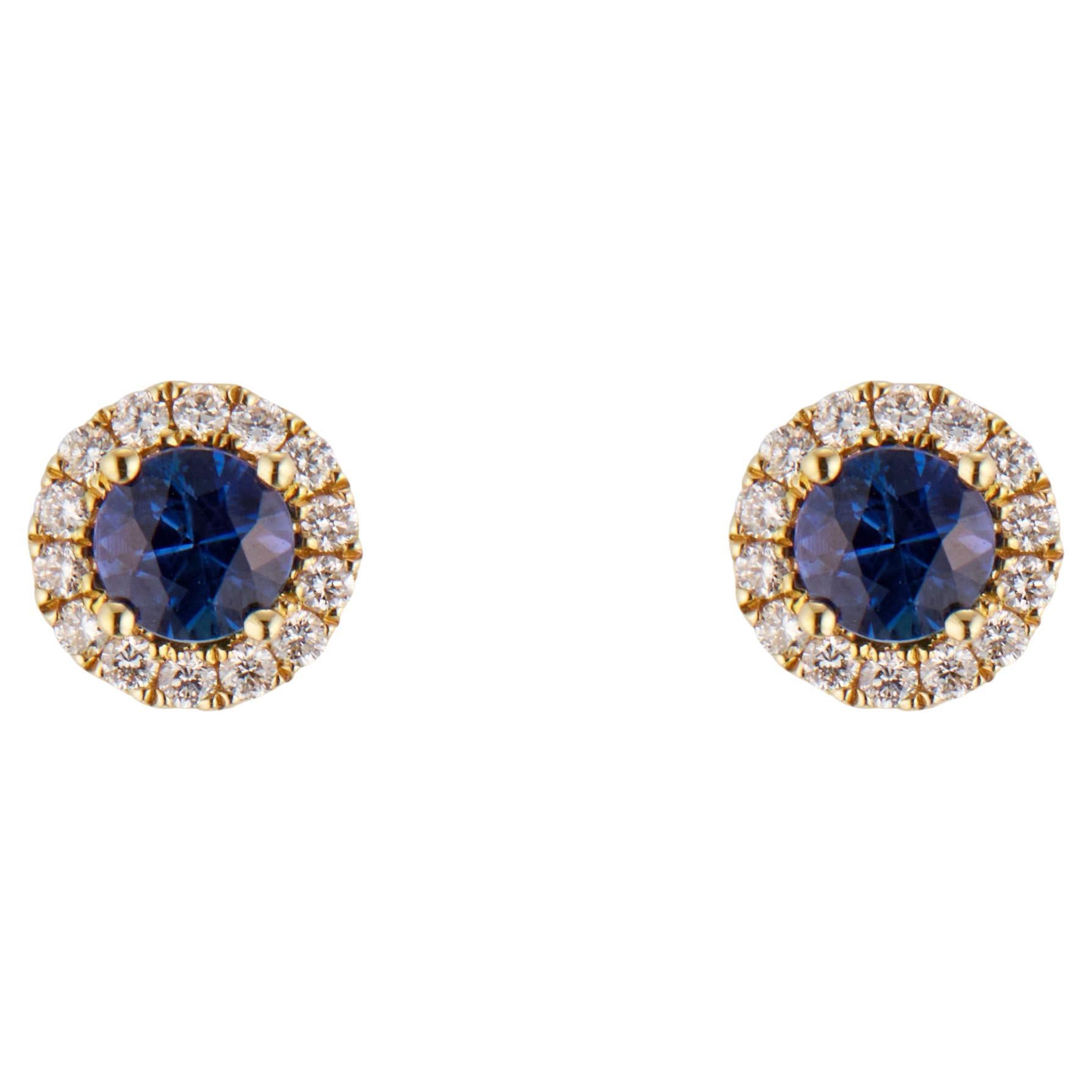 Boucles d'oreilles en or jaune avec halo de diamants et saphirs bleus de 0,60 carat