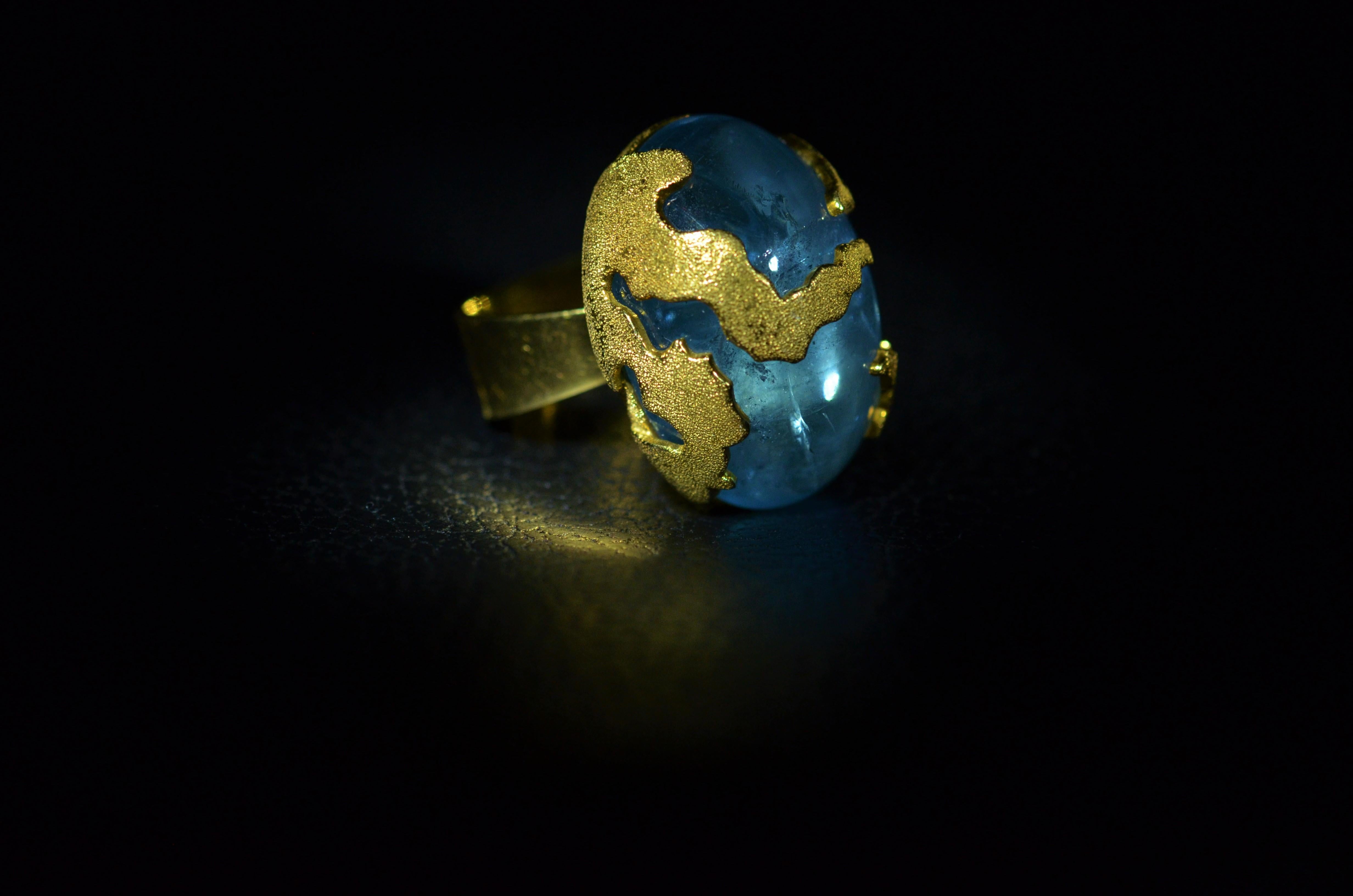 An outstanding 60 Carat Cabochon Santa Maria old mine Aquamarine Ring in 18 Karat Yellow Gold.  The top of the ring is finished with a unique Florentine finish. The ring is signed but the maker unknown from a very wealthy prominent New York City
