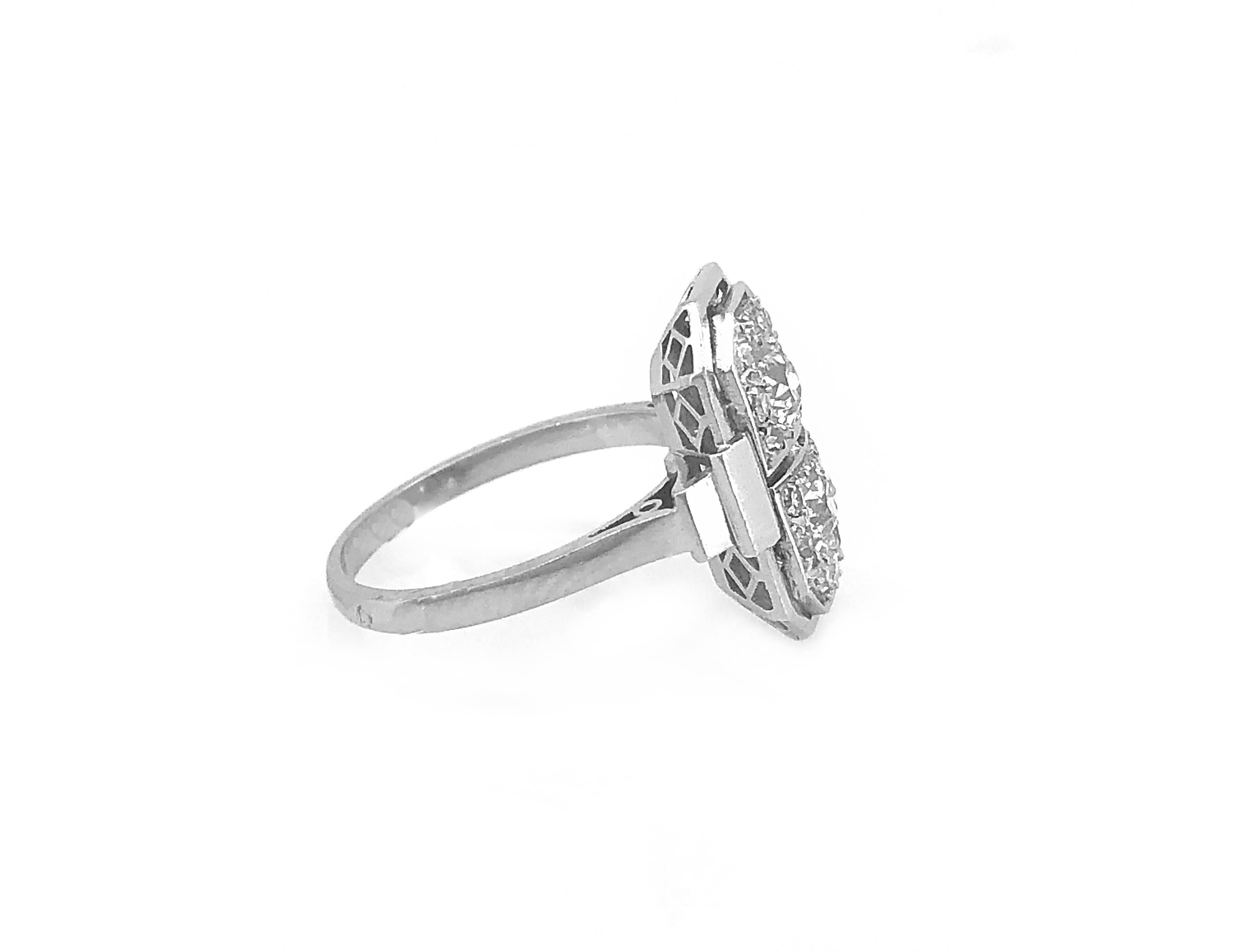 An exquisitely detailed 18k White Gold Art Deco diamond Antique engagement or fashion ring that features .60ct. apx. T.W. of European & Transitional cut diamonds with VS2-SI1 clarity and G-H color which are bright white and sparkling. This ring is