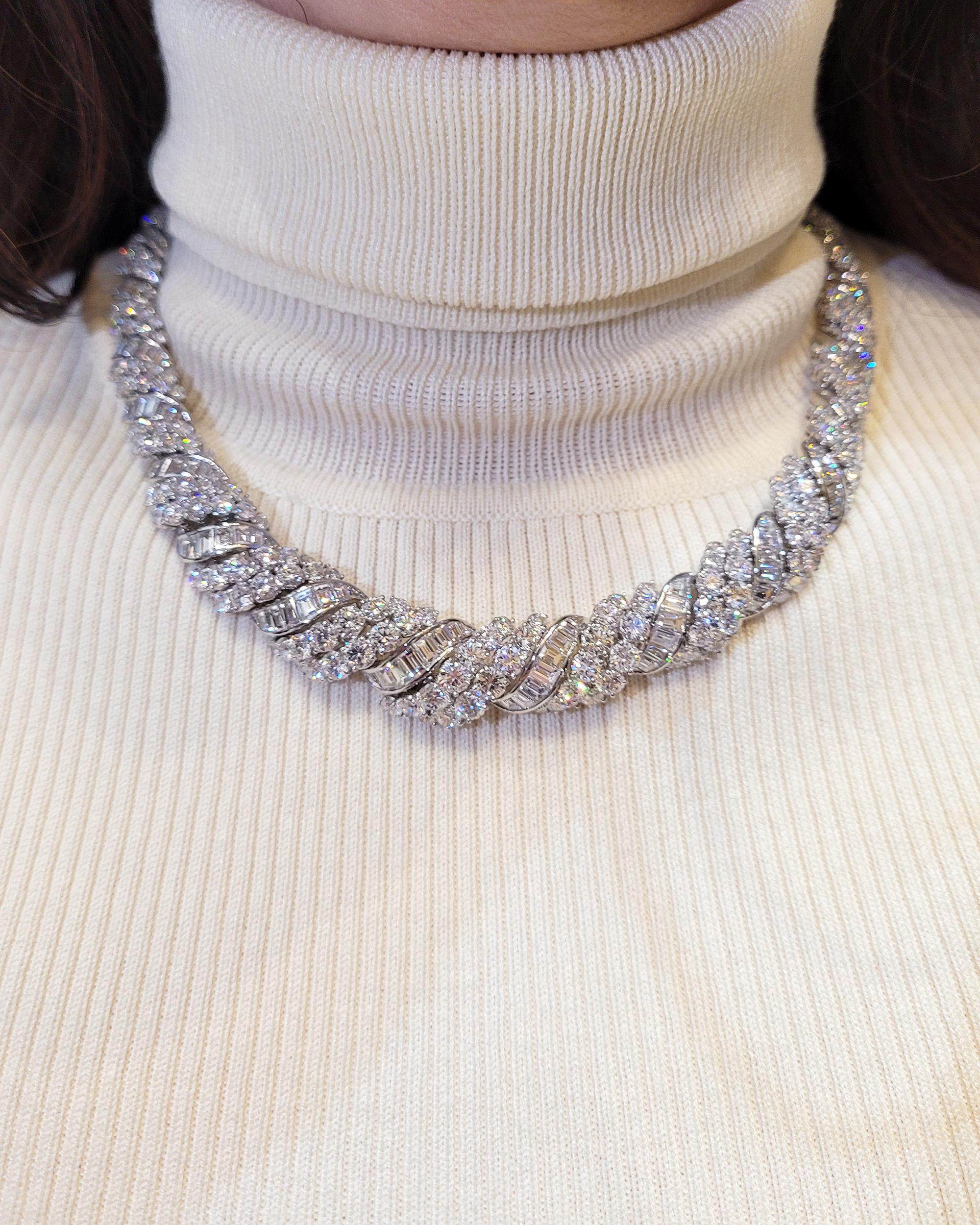 Embark on a journey of refined opulence with this Radiant Scrolls Diamond Necklace - an exquisite embodiment of timeless luxury. Crafted in the rarefied embrace of platinum, this necklace is a dazzling testament to the artistry of haute joaillerie.