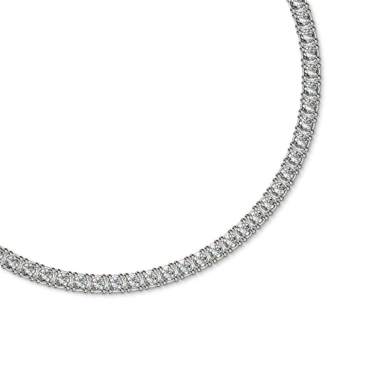 This 60-carat diamond tennis necklace is a true masterpiece of brilliance and elegance. Comprising perfectly matched 0.70-carat diamonds, this necklace radiates a seamless stream of fire and light, offering a graceful yet bold statement. Each