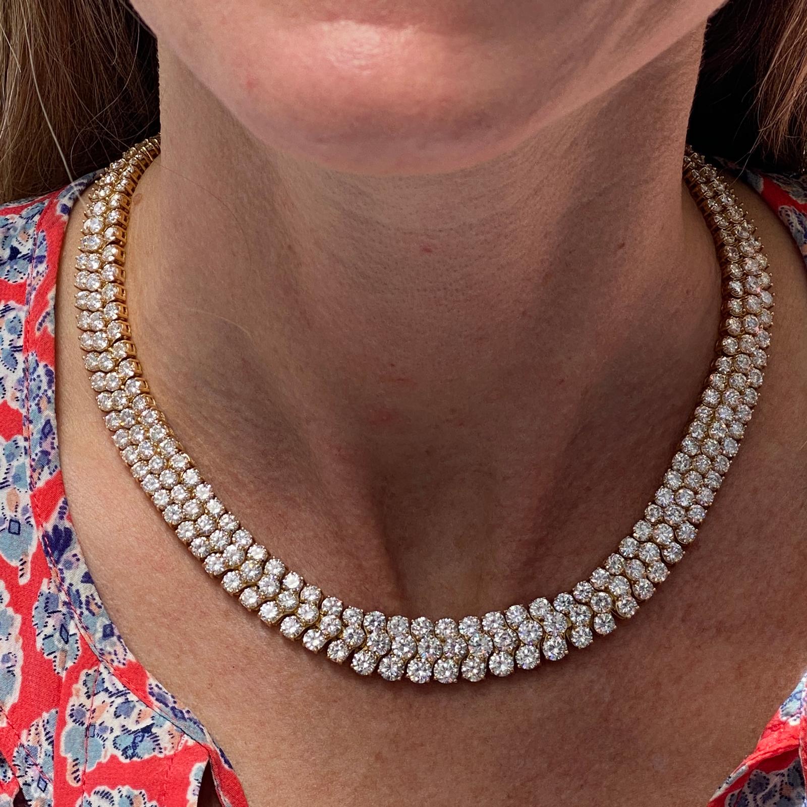 Stunning three row diamond necklace fashioned in 18 karat yellow gold. The choker features 300 round brilliant cut diamonds totaling 60.00 carat total weight. The high quality diamonds are graded F-G color and VS clarity. The necklace measures 15.5