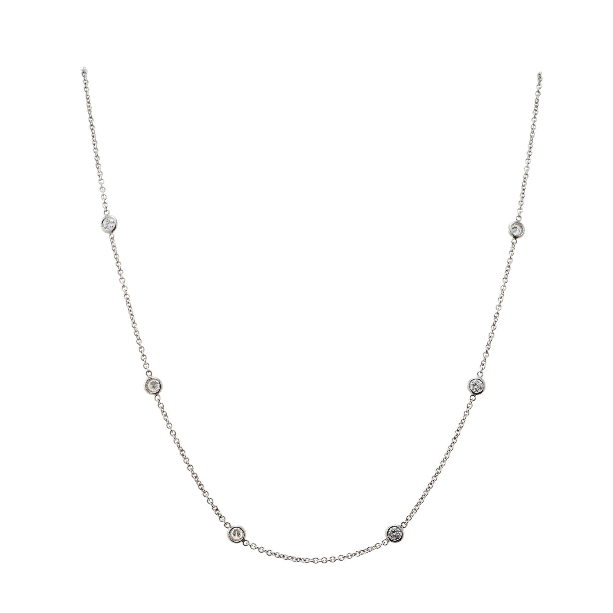18k white gold 16 Inch necklace set diamond by the yard with six round brilliant cut diamonds.

6 round brilliant cut diamonds, G-H VS-SI approx. .60cts
18k white gold
Stamped: 750
4.1 grams
Chain: 16 Inches
Width: 4.5mm 
Thickness/depth: 1.6mm



