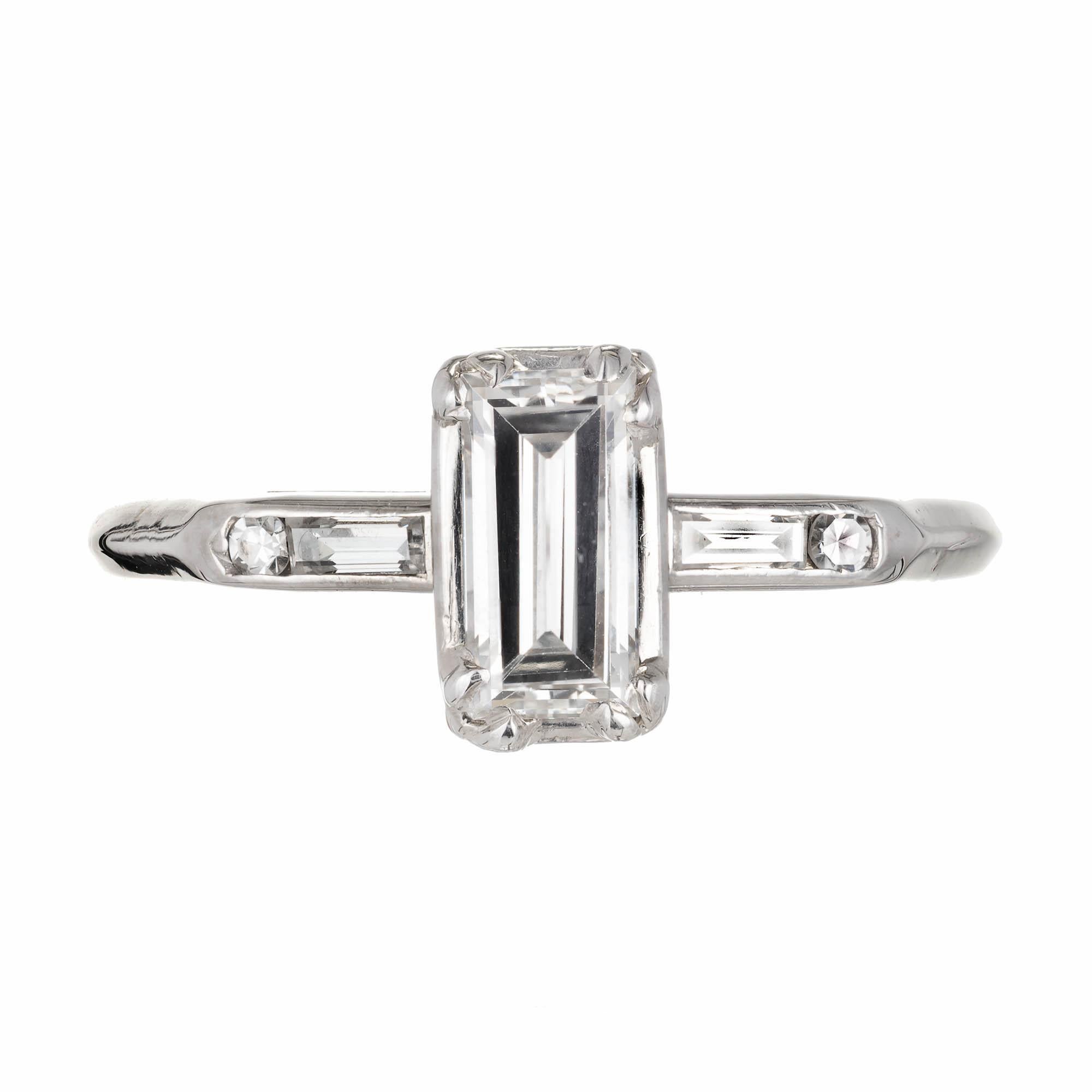 Vintage all original 1950 bright emerald step cut diamond ring with baguette and round diamond accents.

1 rectangular step cut G-H VS2 Diamond Approximate .60 carats. EGL Certificate US 314492602D
2 straight cut baguette G VS diamonds Approximate