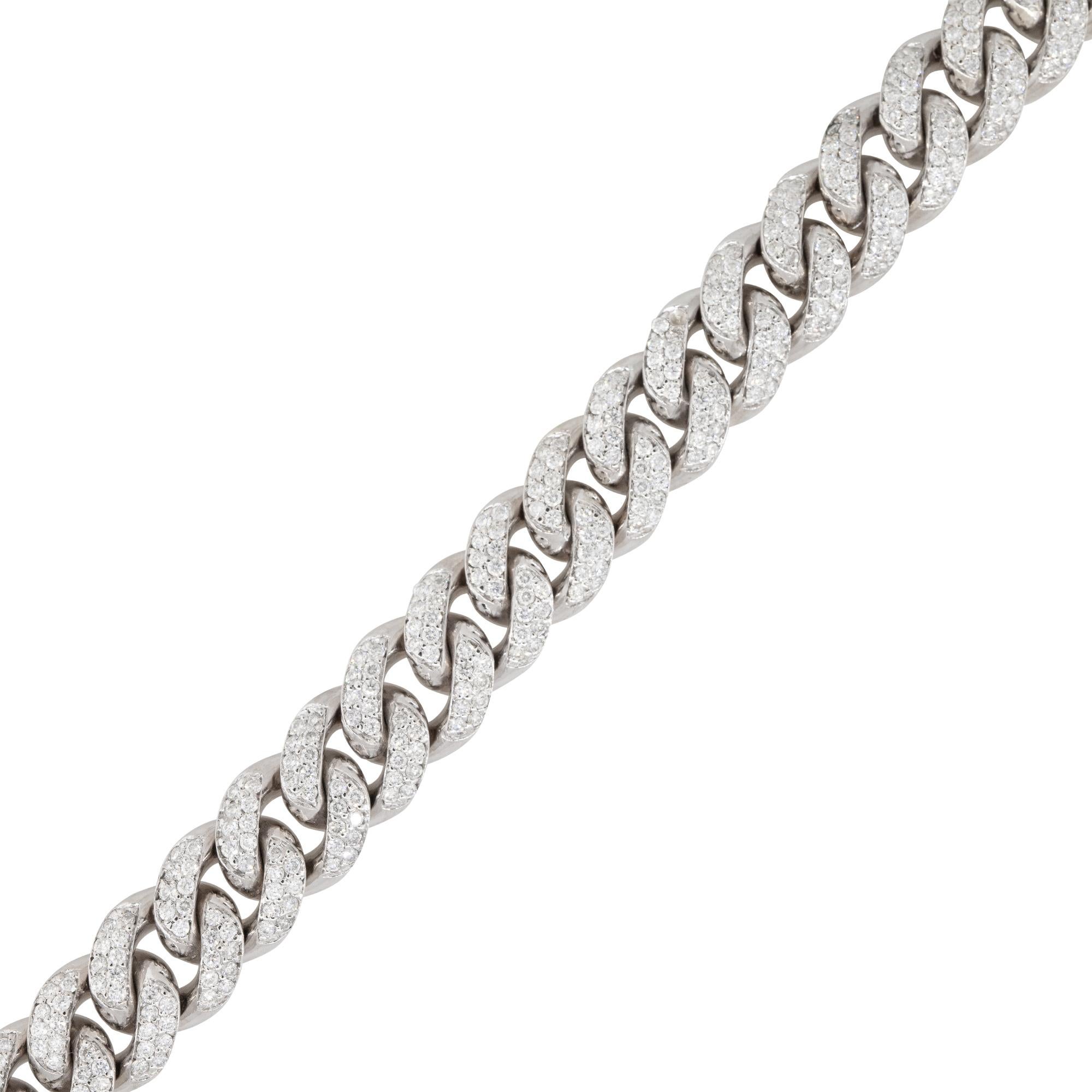 This 6.0 carat pave diamond Cuban link bracelet features a classic Cuban link design, which is known for its interlocking pattern of thick, flat, interlocking links that create a bold and substantial look. The bracelet is made of high-quality 14k