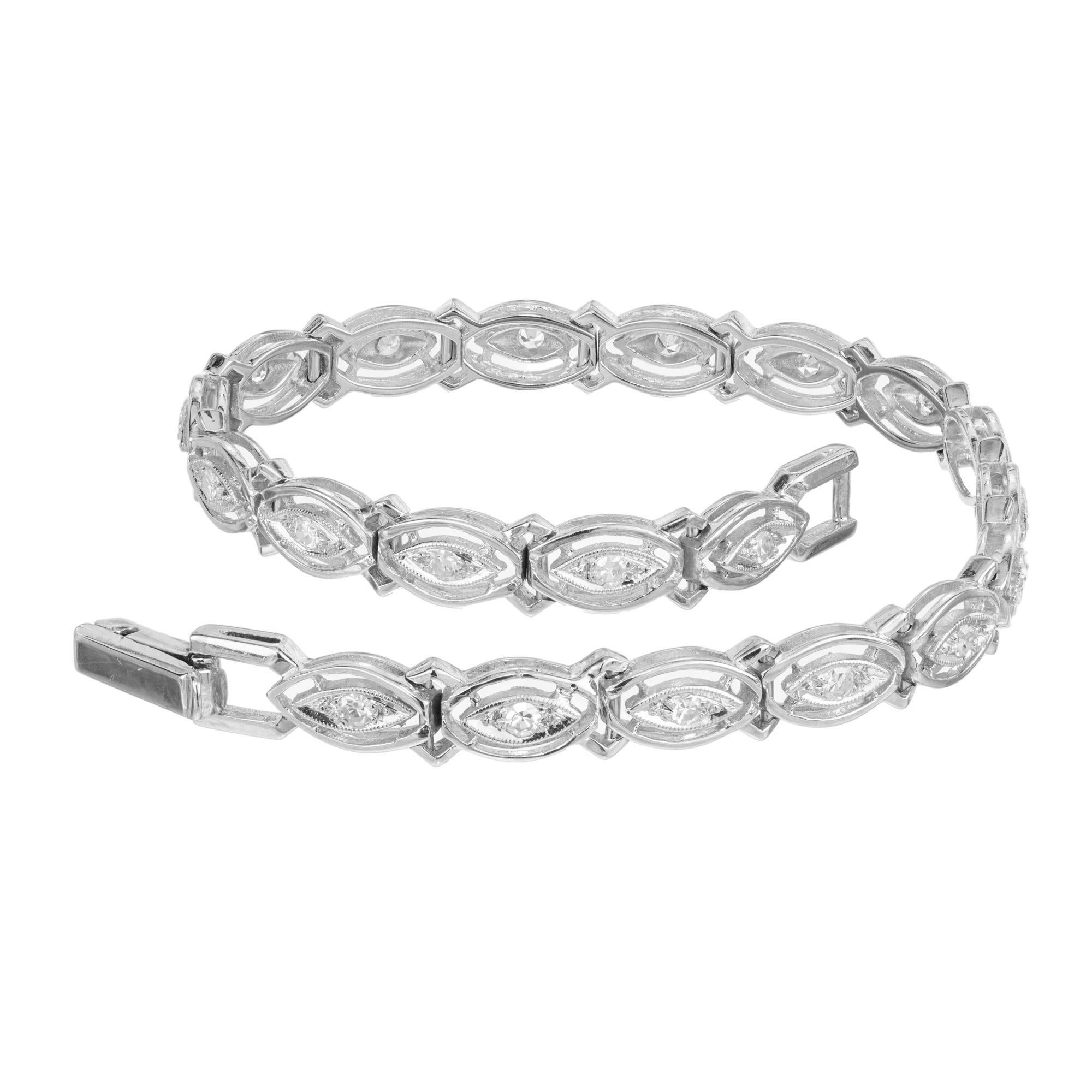 Late Art Deco, 1940's diamond and white gold bracelet. This unique bracelet is adorned with 20 single cut diamonds that are mounted in a marquise shape setting with a second marquise shape halo. Constructed in 14k white gold this link bracelet