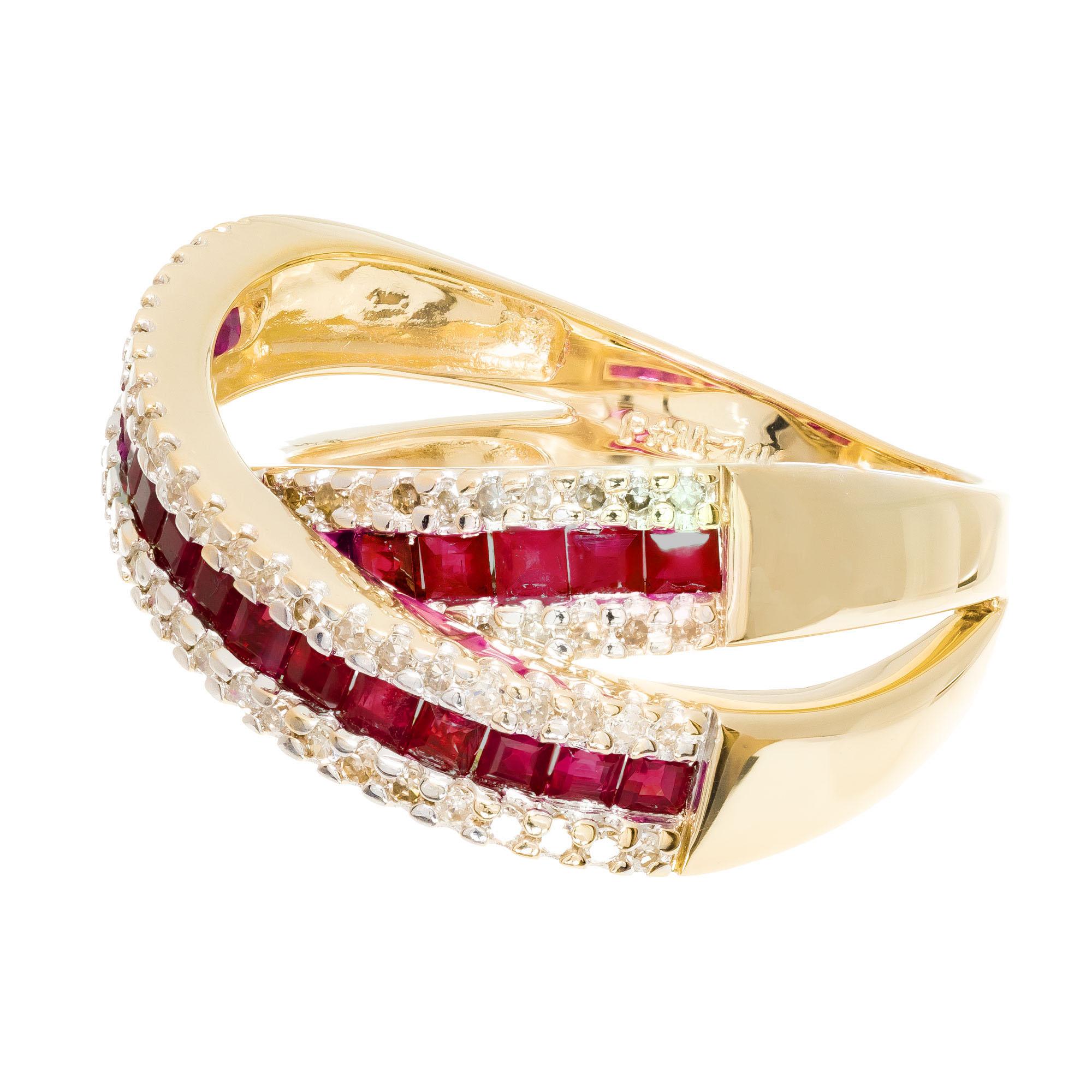 Ruby and diamond cross over band ring. 24 square cut rubies with 66 round diamonds in a 14k yellow gold setting.  

24 square red Rubies, approx. total weight .60cts, SI, 1.93 x 1.86mm
66 round Diamonds, approx. total weight .25cts, I, SI – I
Size 7