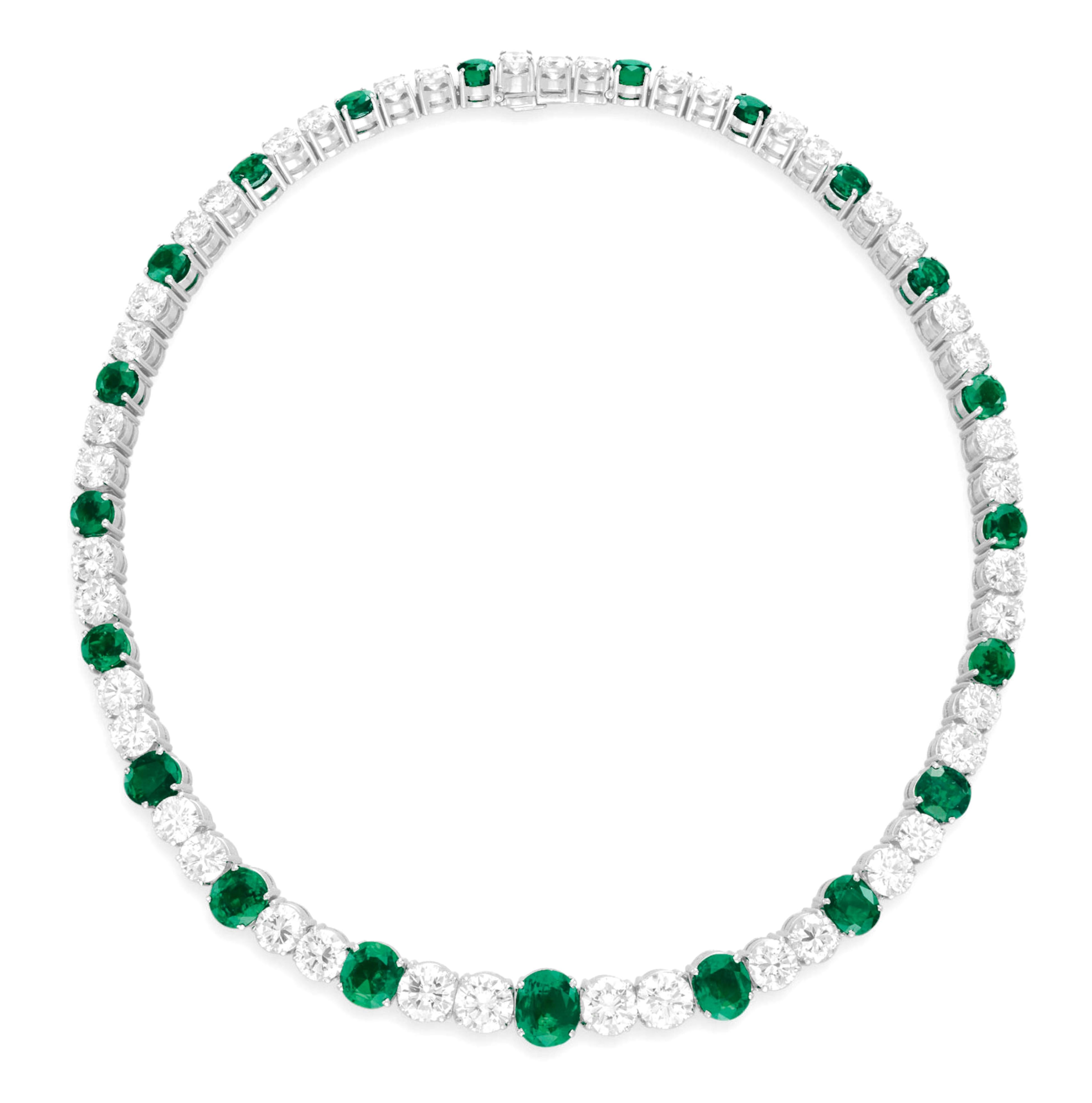 This stunning Colombian Emerald and Diamond Necklace is designed as a graduated series of oval-cut emeralds, separated by a graduated arrangement of twin-set circular-cut diamonds, all mounted in platinum. The necklace measures 14½ inches in