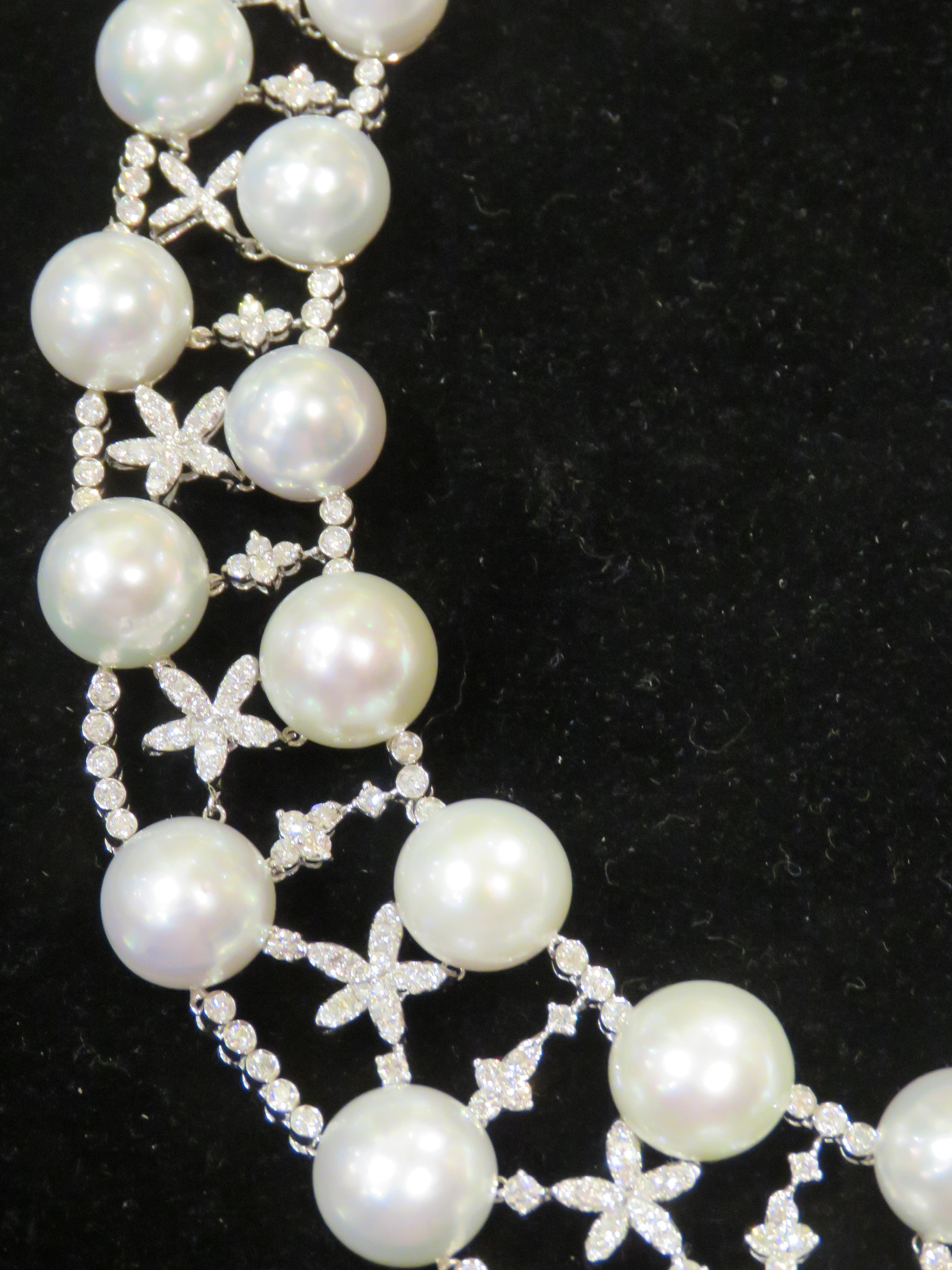 The Following Item we are Offering is this Magnificent 18KT Gold Large Extremely Rare South Sea Pearl and Fancy Diamond Necklace. This Spectacular Necklace contains 42 Large 11-12.6MM  AA-AAA Rare High Luster Whitel South Sea Pearls and approx