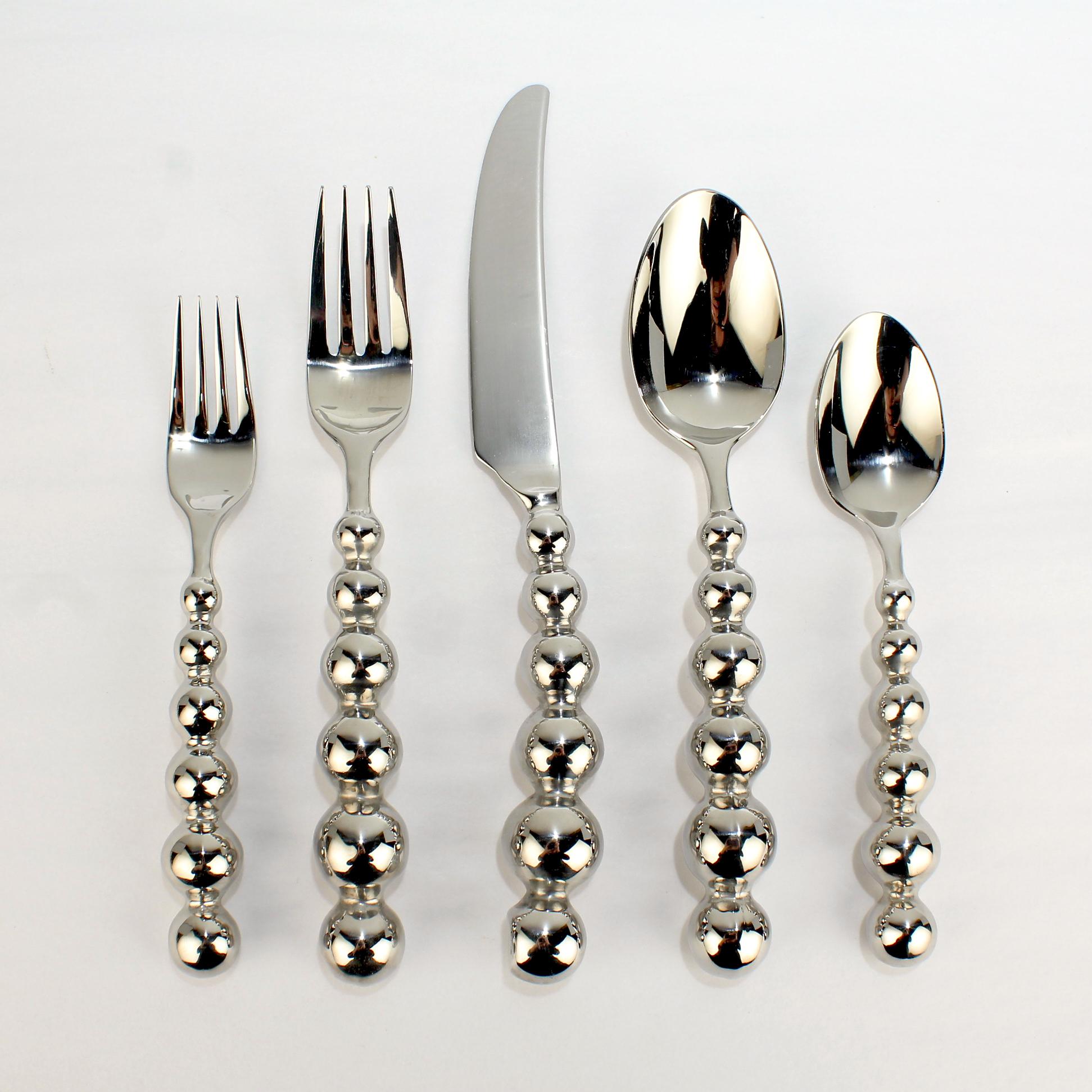 Offered here for your consideration is a far-out set of flatware by Cambridge in stainless steel.

This pattern called 'Galaxy' appears to have been short-lived. 

We can find very little about the pattern from this large international flatware