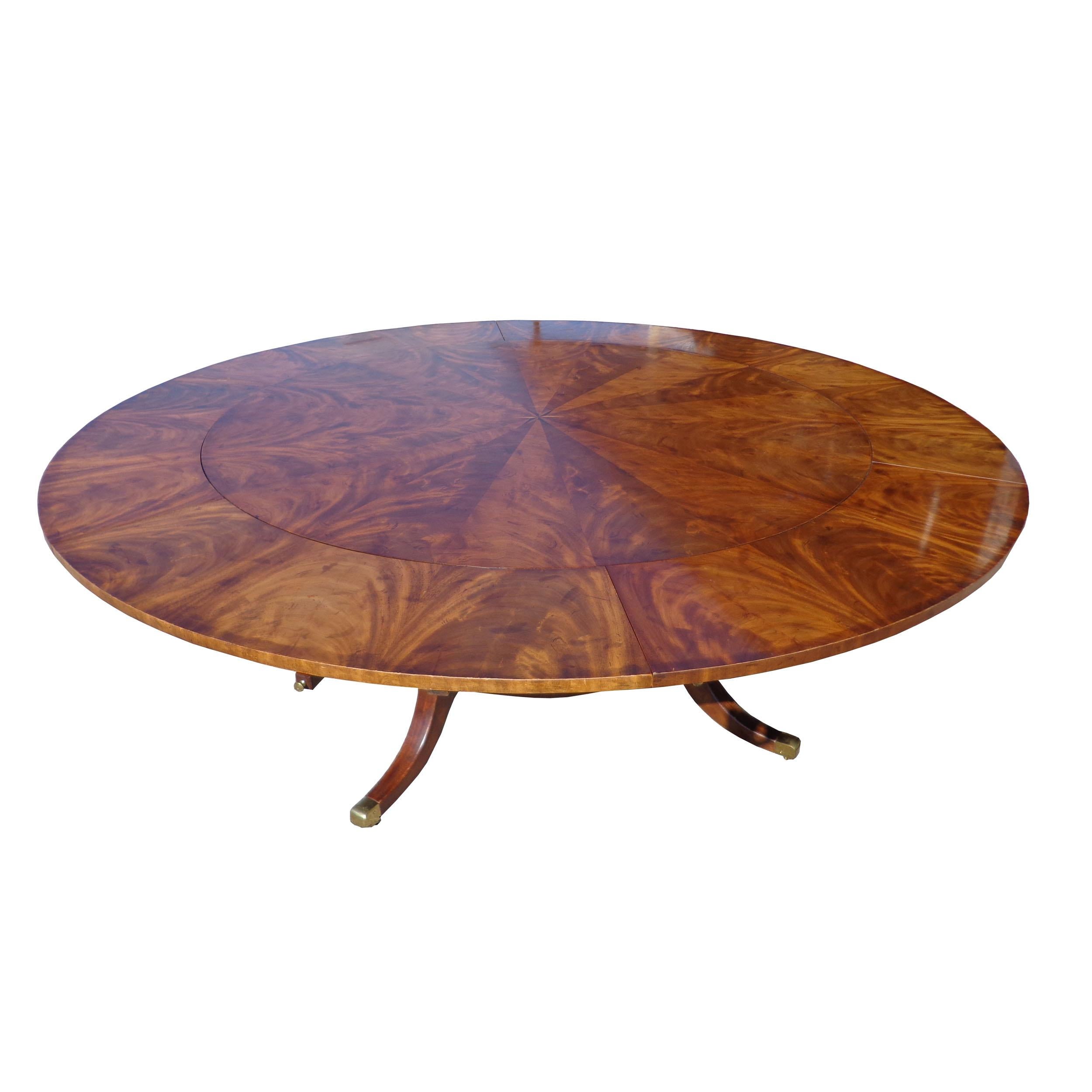 Regency Revival Jupe extendable Burl dining table 

The form of this extraordinary table was invented by Theodore Alexander Robert Jupe in 1835.

Beautiful burl walnut designed in segments consisting of 5 elliptical shaped leaves that are