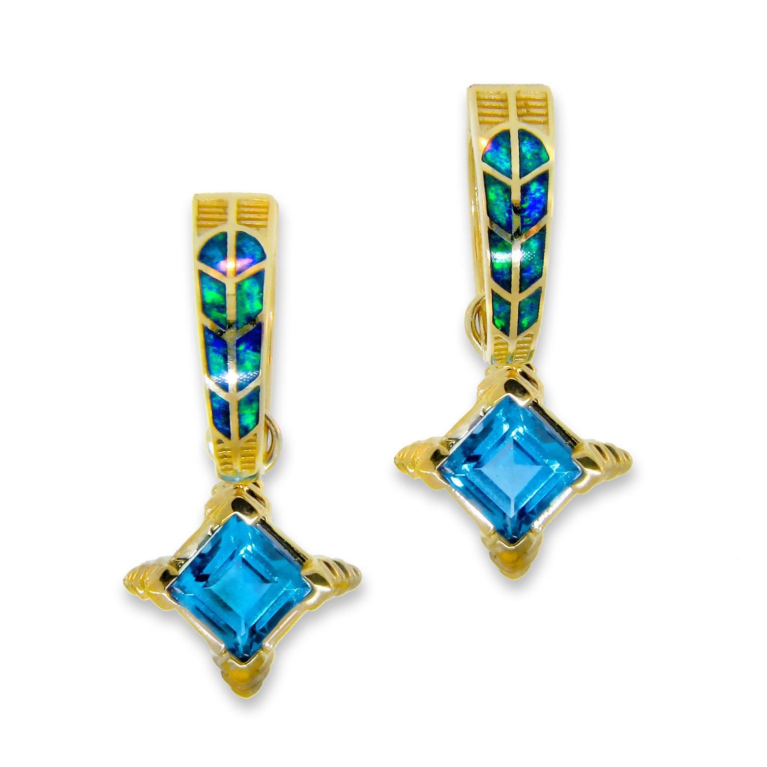 Extraordinary Australian Opal earrings, passionately created by International award-winning jewelry designer Jonathan Duran. These earrings, expertly crafted in 14 karat yellow gold, prominently feature a princess cut Blue Topaz, 6.00 carats total