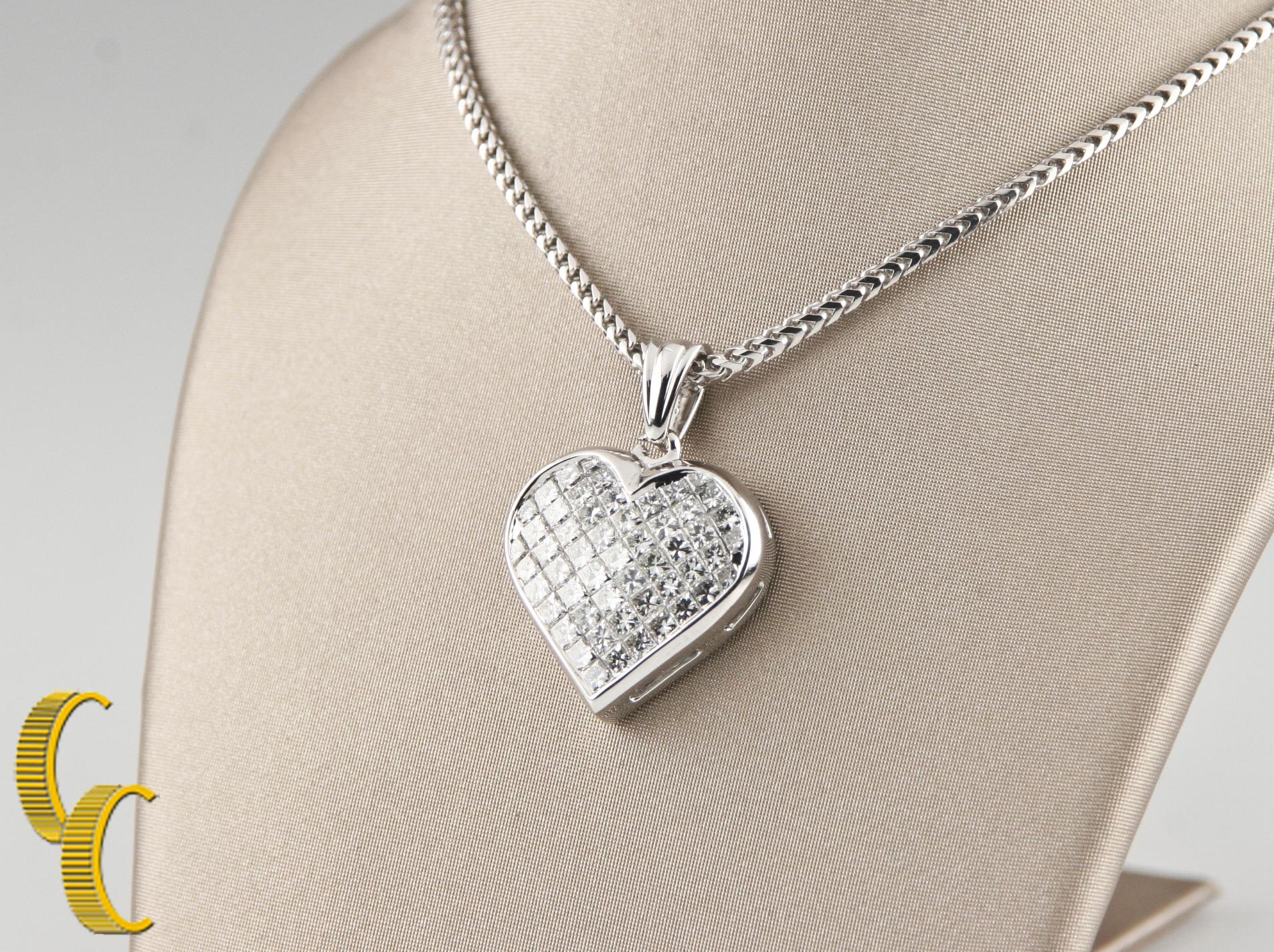 Gorgeous 18k White Gold Diamond Heart Pendant
Features Heart Filled with Invisible-Set Princess Cut Diamonds
21 mm Wide
19 mm Long
Hallmarked 