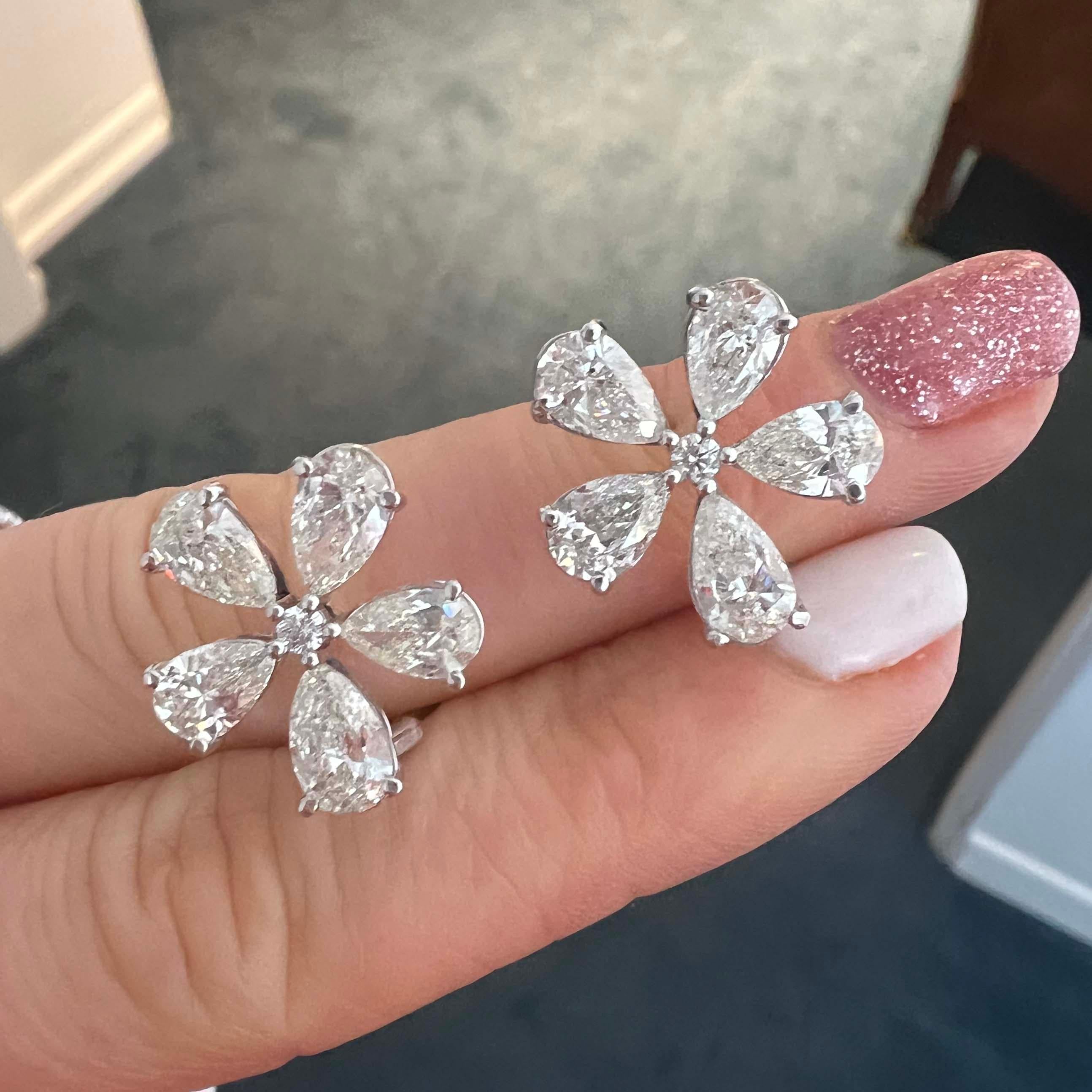 Spectacular 6.00-carat cluster floral earrings. The earrings are 6.00 carat in total weight. Based on the grading of our GIA-certified gemologists, the stones are estimated to be G/H VS/ SI. Each stone averages 0.60 carats. The earrings are crafted