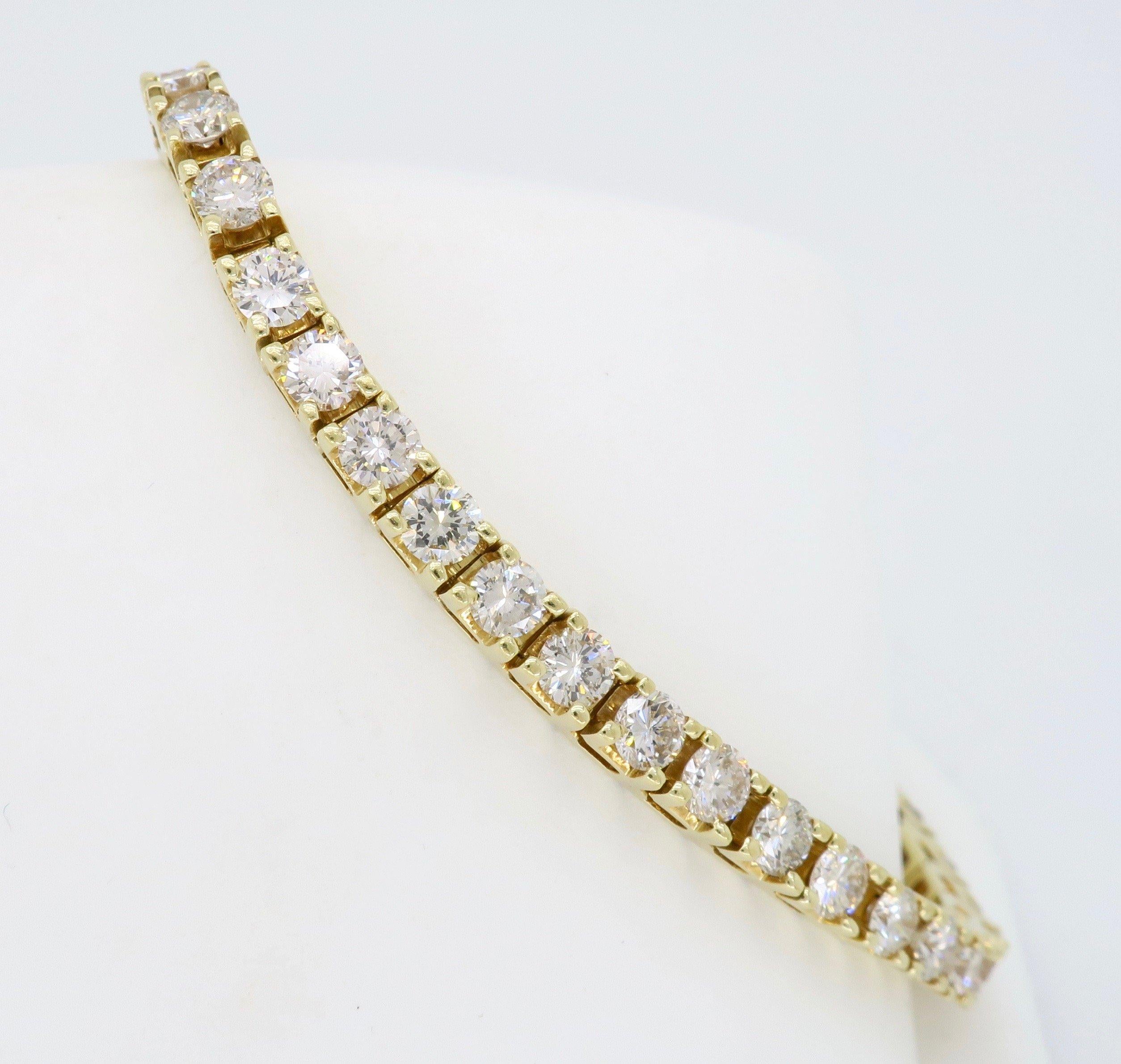 14K yellow gold tennis bracelet mounted with approximately six carats of Round Brilliant Cut diamonds.

Diamond Carat Weight: Approximately 6.00CTW
Diamond Cut: 46 Round Brilliant Cut
Color: Average I-K
Clarity: Average VS-SI
Metal: 14K Yellow