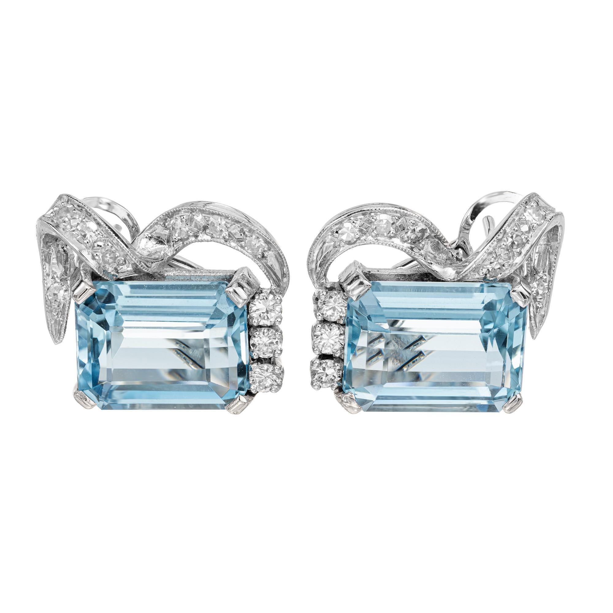 Helle Aquamarine mit Smaragdschliff und Diamanten als Clip Post-Ohrringe.  Eleganz und Raffinesse. Besetzt mit 2 Aquas im Smaragdschliff mit einem Gesamtgewicht von 6,00cts. Akzentuiert durch 20 runde Diamanten im Voll- und Einzelschliff. Die