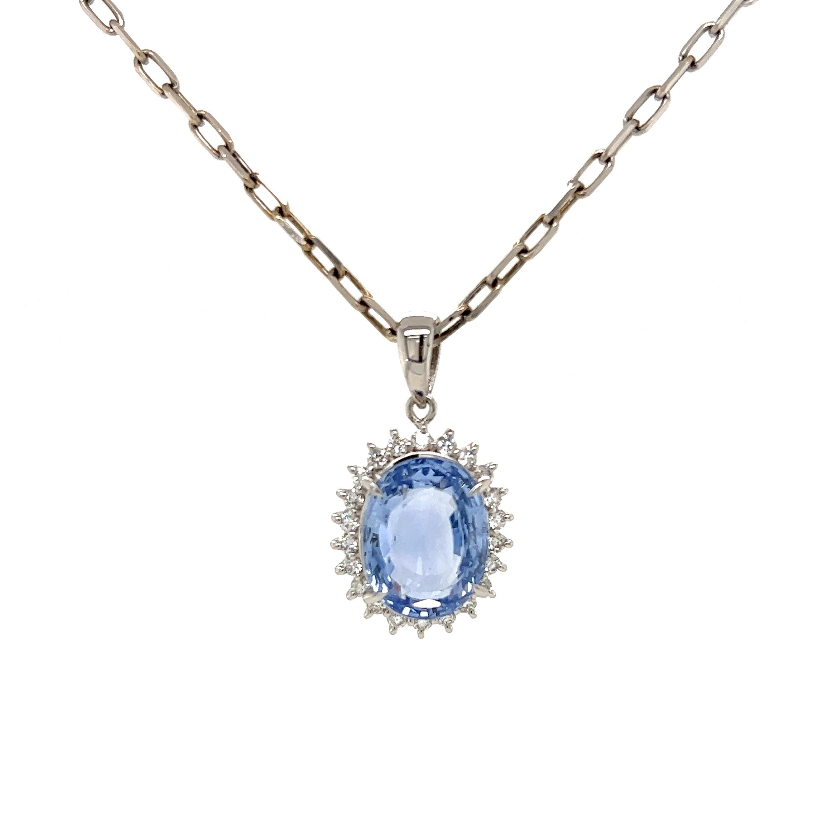 Simply Beautiful! Sapphire and Diamond Platinum Drop Pendant Necklace. Center securely Hand set with a 6.00 Carat Oval NO HEAT Sapphire GIA # 2223255132. Surrounded by Diamonds approx. 0.35tcw. Pendant dimensions: 0.97” L x 0.55” W x 0.27” D.