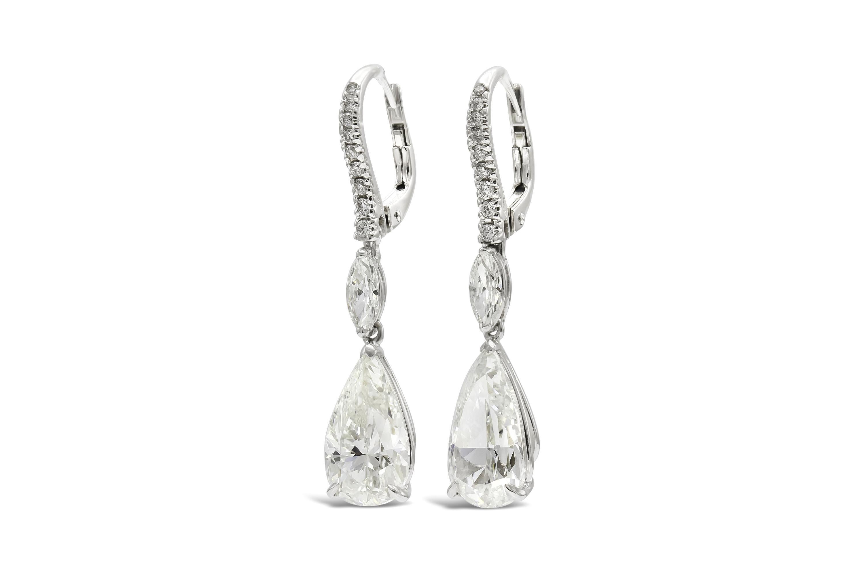 Finely crafted in 18k white gold with 2 GIA certified Pear-Shaped Diamonds;
3.00 carats, H color, SI2 clarity, GIA #2225366408
3.00 carats, I color, SI1 clarity, GIA #6224366414
The earrings feature 2 Marquise cut and small Round Brilliant cut