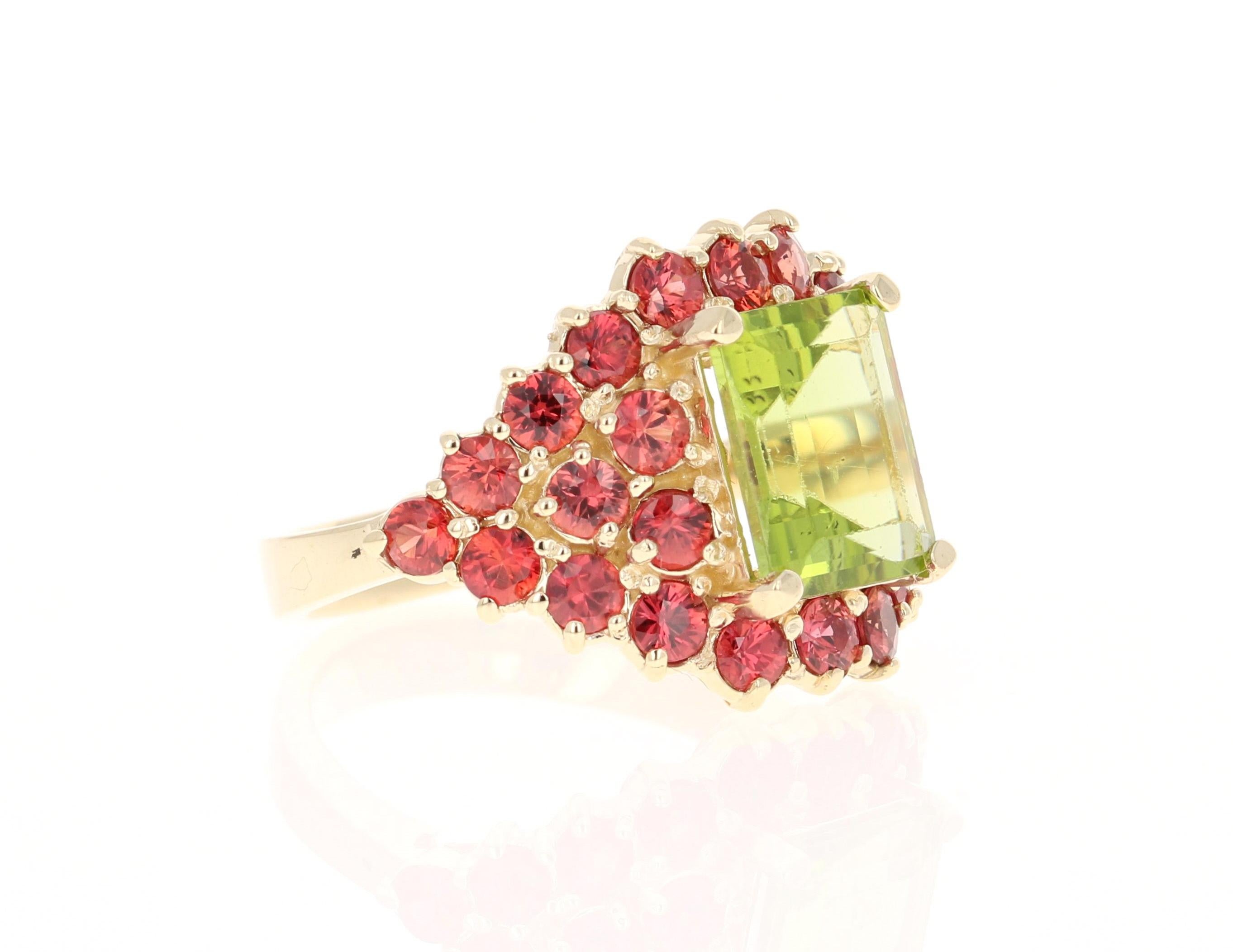 This ring has a Emerald Cut Peridot that weighs 3.35 carats and 26 Red Sapphires that weigh 2.65 carats. The total carat weight of the ring is 6.00 carats. 

The ring is curated in 14 Karat Yellow Gold and has an approximate weight of 6.9 grams