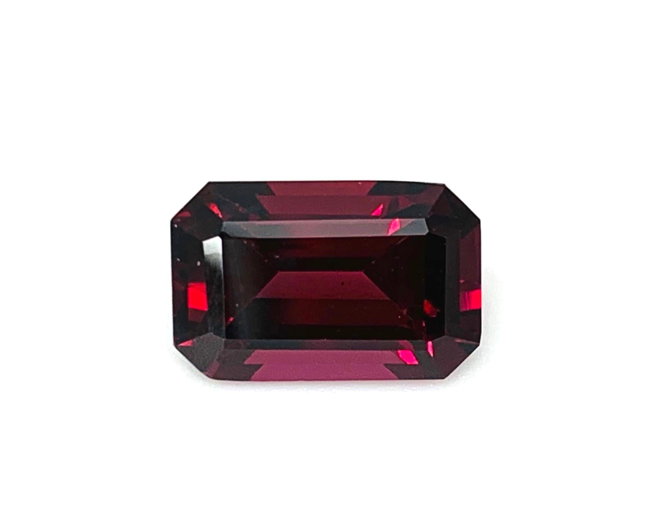 This gorgeous ruby red pyrope rhodolite garnet is stunning! It is an exceptionally bright and lively gem with a rich, slightly pinkish red color and excellent clarity. Measuring 12.46 x 8.27 x 6.13 millimeters, this pyrope garnet is extremely well