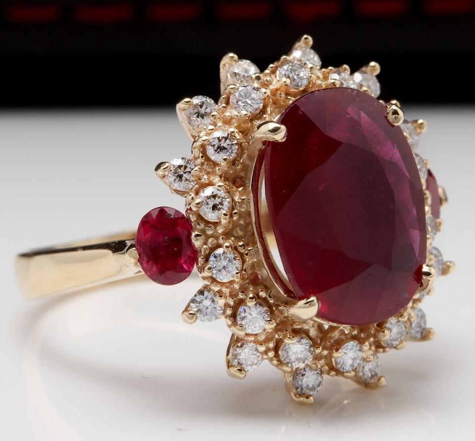 6.00 Carats Impressive Red Ruby and Diamond 14K Yellow Gold Ring

Total Red Ruby Weight is: 5.25 Carats (glass-filled)

Ruby Measures: 12.14 x 9.65mm

Natural Round Diamonds Weight: .75 Carats (color G / Clarity SI1)

Ring size: 6 (we offer free