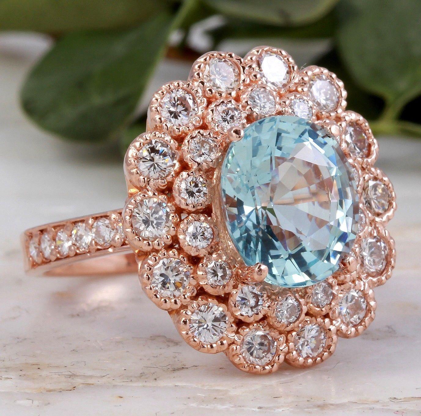 6.00 Carats Natural Aquamarine and Diamond 14K Solid Rose Gold Ring

Total Natural Oval Cut Aquamarine Weights: Approx. 4.00 Carats

Center Aquamarine Measures: Approx. 10.00 x 8.00mm

Natural Round Diamonds Weight: Approx. 2.00 Carats (color G-H /