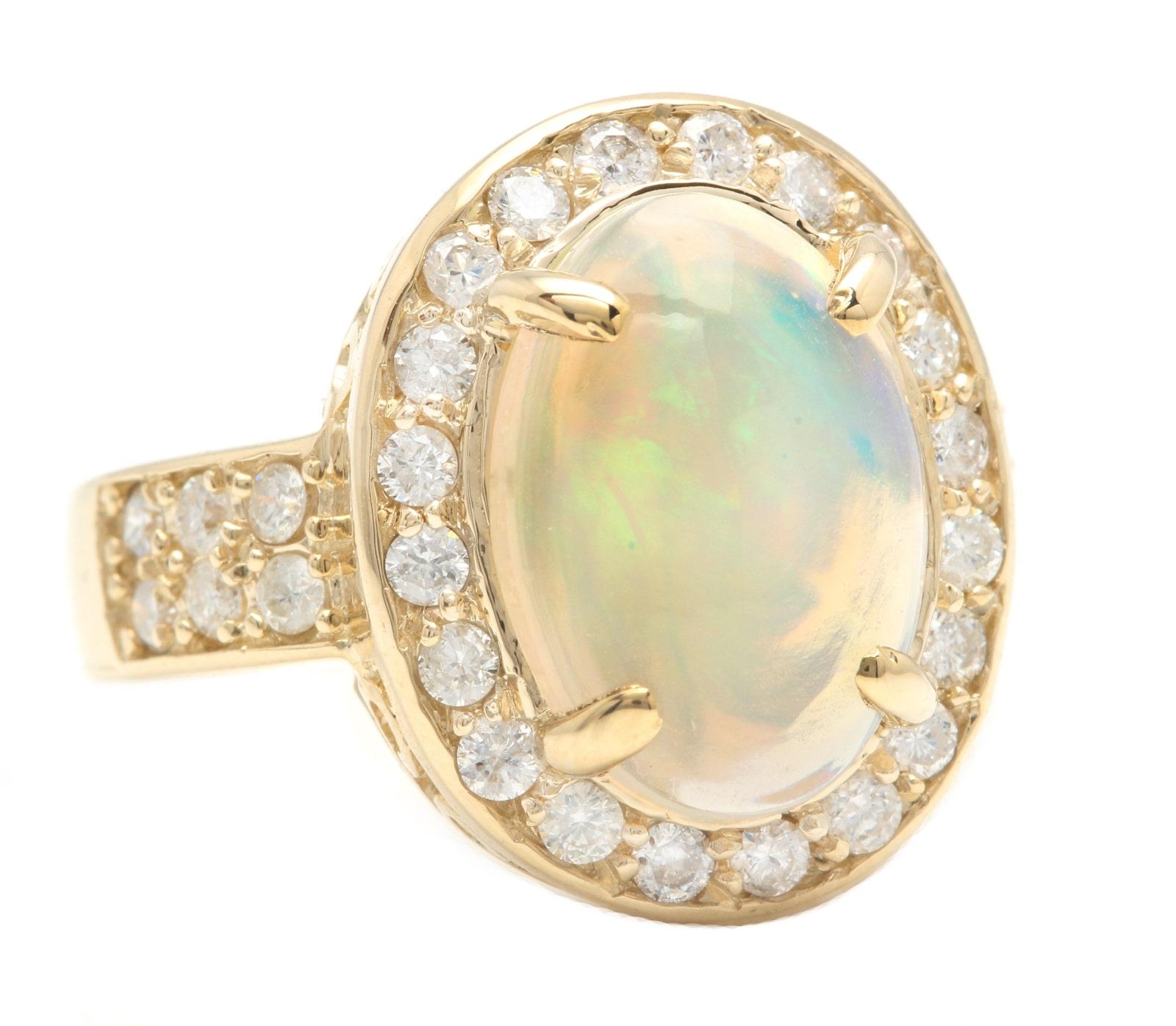 6.00 Carats Natural  Impressive Ethiopian Opal and Diamond 14K Solid Yellow Gold Ring

Suggested Replacement Value: $6,000.00

Total Natural Opal Weight is: Approx. 5.00 Carats 

Opal Measures: Approx. 14.00x 10.00mm

Total Natural Round Diamonds