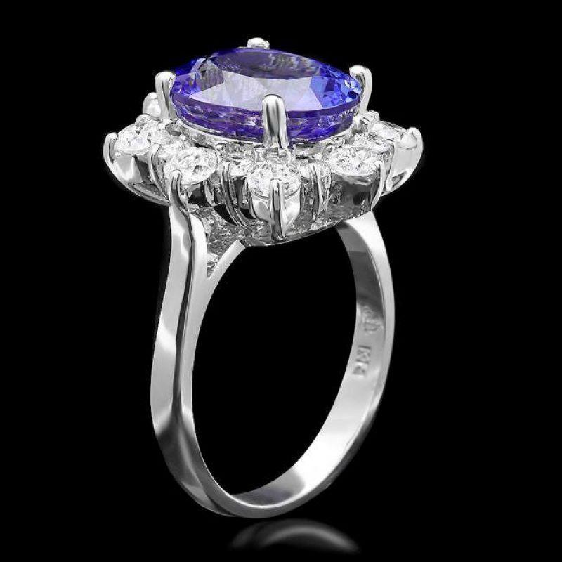 6.00 Carats Natural Tanzanite and Diamond 14K Solid White Gold Ring

Total Natural Tanzanite Weight is: Approx. 4.90 Carats 

Tanzanite Measures: Approx. 9.00 x 12.00mm

Natural Round Diamonds Weight: Approx. 1.10 Carats (color G-H / Clarity