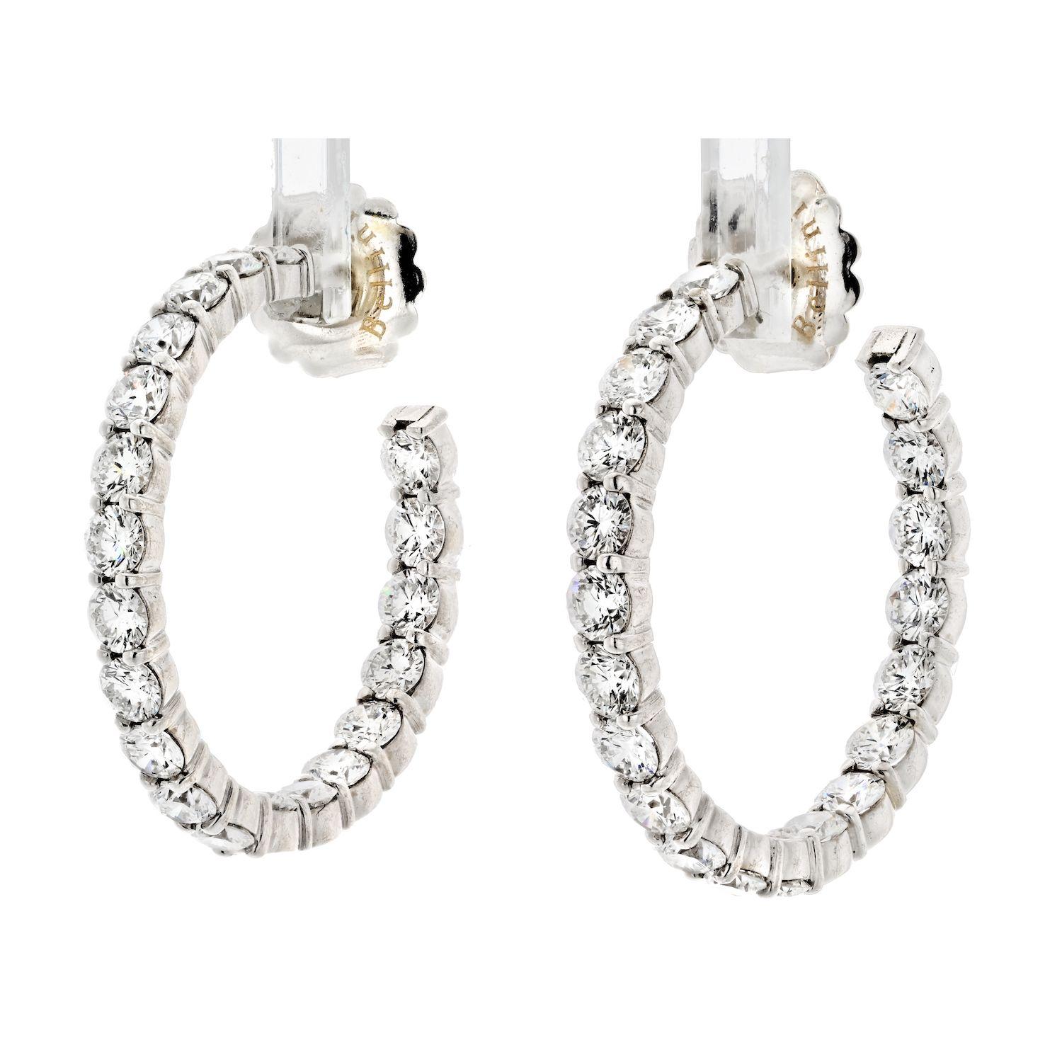 The 6.00 cttw 18K White Gold Round Cut Diamond Hoop Earrings are a dazzling and elegant addition to any jewelry collection. These earrings feature 18K white gold hoops that are studded with round cut diamonds, which give them a luxurious and