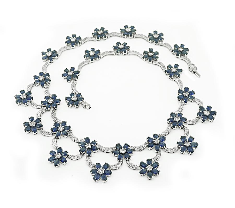 This is a fabulous 14k white gold necklace. The necklace is set with lovely oval cut sapphires that weigh approximately 60.00ct. The sapphires are accentuated by sparkling round cut diamonds that weigh approximately 4.00ct. The color of these