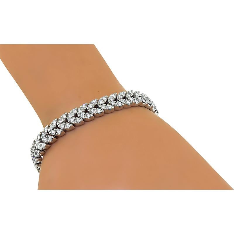 This is an amazing 18k white gold bracelet. The bracelet is set with sparkling round cut diamonds that weigh approximately 6.00ct. The color of these diamonds is G-H with VS clarity. The bracelet measures 7 inches in length and 8mm in width. The