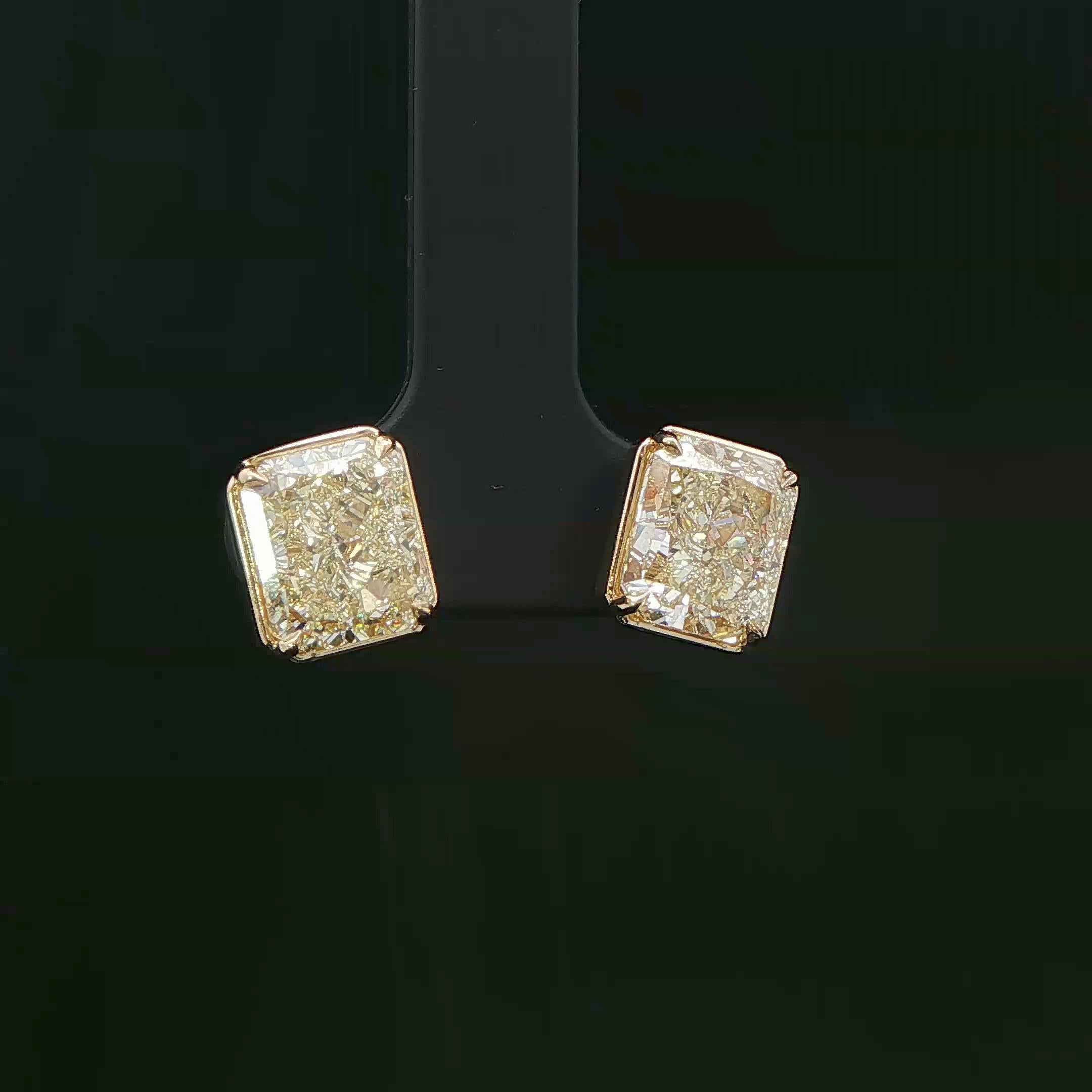 Exquisite stud earrings featuring two radiant brilliant diamonds weigh 6.00ct.  with GIA certified in Y-Z color and VVS1-VS2 clarity set in 18K yellow gold, these earrings offer a touch of luxury and sophistication. 
