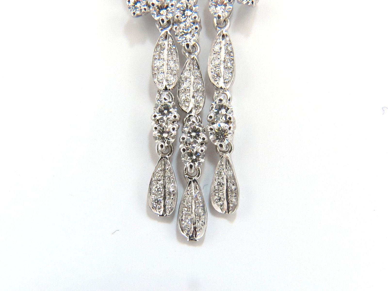 3D Pattern Wishbone & Elegant Petal Dangles. 

Modern long chandelier Dangle earrings.

6.00cts of natural round diamonds: 

G-color, Vs-2  clarity.

18kt. white gold

14.5 grams.

Earrings measure: 2.8 Inch Length

Upper cluster measurement:

.67