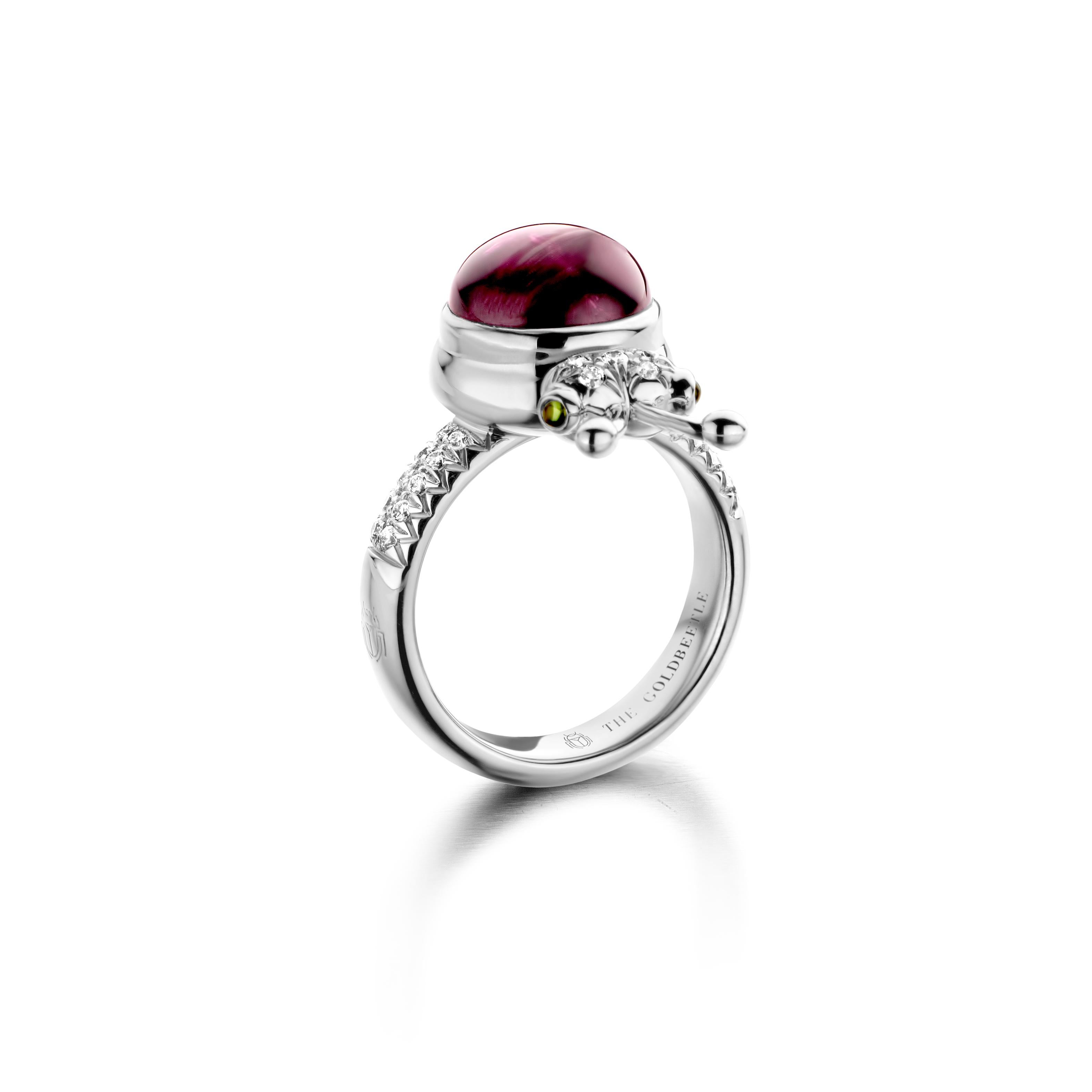 One of a kind lucky beetle ring in 18K rose gold 10g set with the finest diamonds in brilliant cut 0,23Ct (VVS/DEF quality) one natural, rhodolite garnet in round cabochon cut 6,00Ct and two tsavorites in round cabochon cut. 

Celine Roelens, a