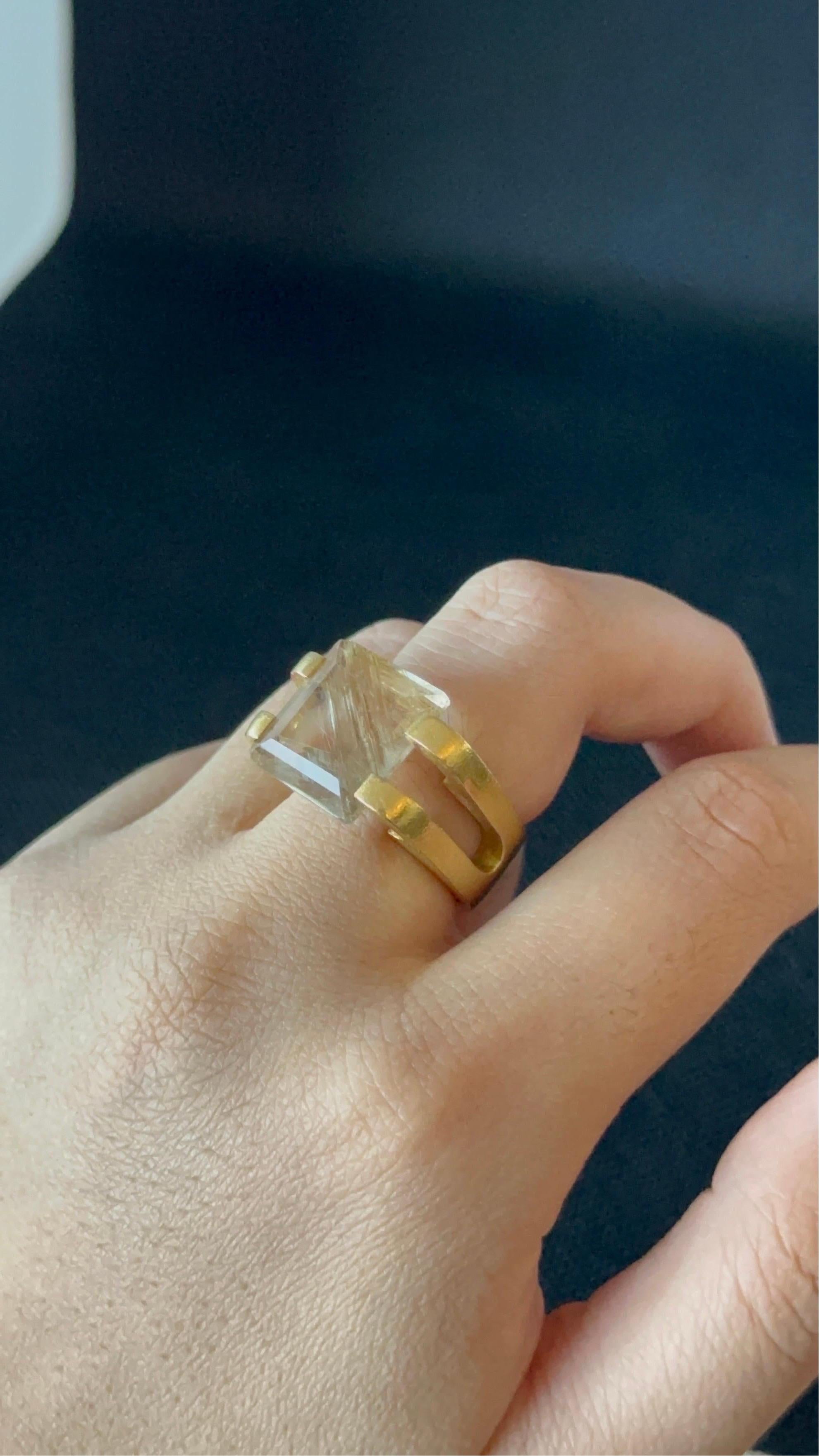 18k Yellow Gold Ring Set with a 6.00ct Rutilated Quartz
Center Stone

Gold Purity: 18K Solid Gold 
Gold Weight: 15.68g
Gold Color: Yellow Gold 
Gem: Rutilated Quartz
Weight: Approx. 6.00ct
