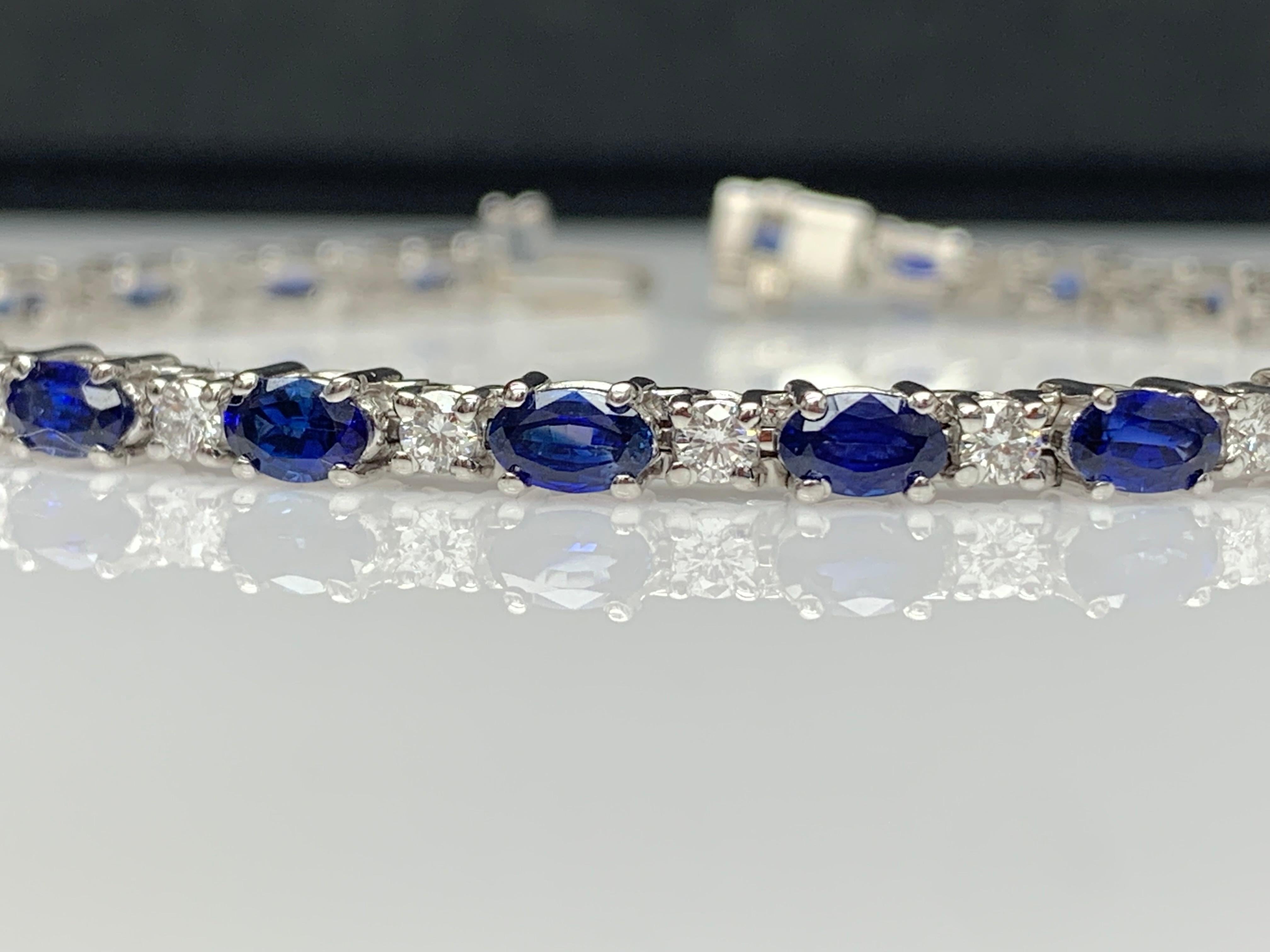 Showcasing 6.01 carats total of 23 oval cut blue sapphires, elegantly alternating with 1.15 carats of 23 round brilliant diamonds. Made in 14 karat white gold.

Style available in different price ranges. Prices are based on your selection of the