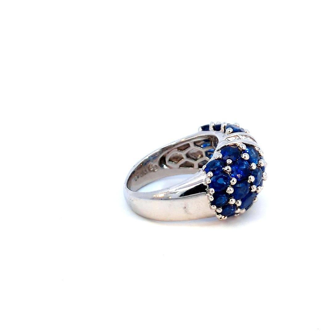Introducing our exquisite 6.01 Carat Natural Blue Sapphire and Diamond Cluster Platinum Ring, a true embodiment of elegance and luxury. Crafted with precision and passion, this stunning piece is sure to captivate hearts and turn heads with its