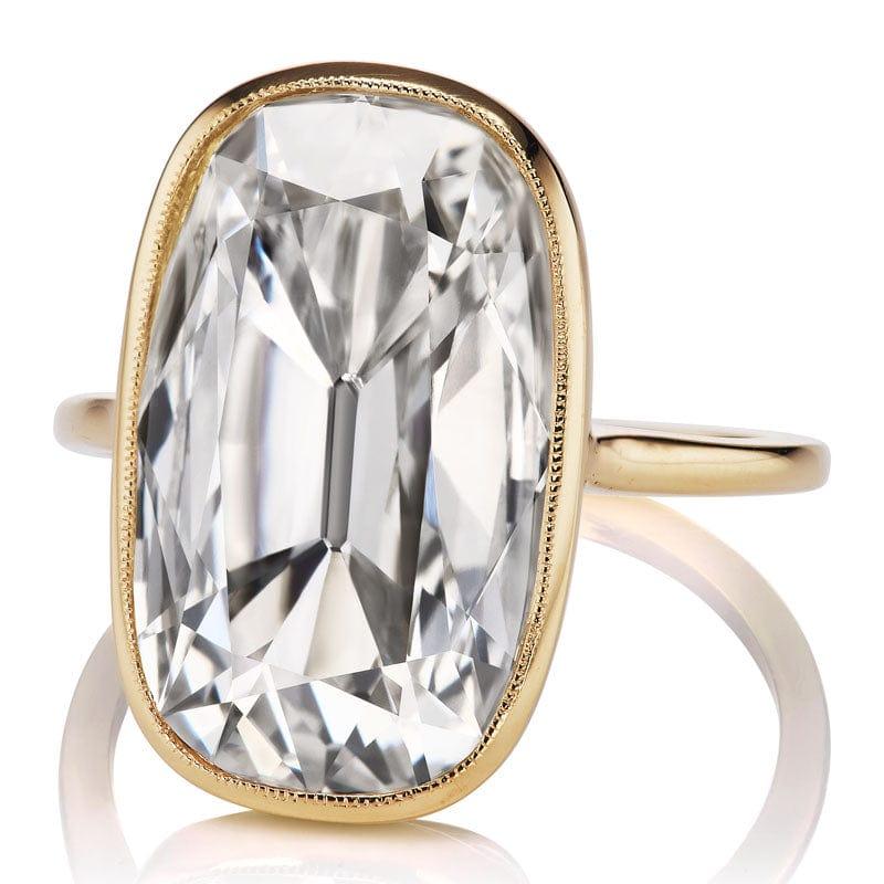 This ring is a 6.02-Carat ring is a VB original design made right here in NYC. The ring centers a GIA-certified 6.02-carat Antique Style Cushion Cut Diamond of L Faint Brown color, VS2 clarity. The stone is bezel-set in an 18kt yellow gold setting