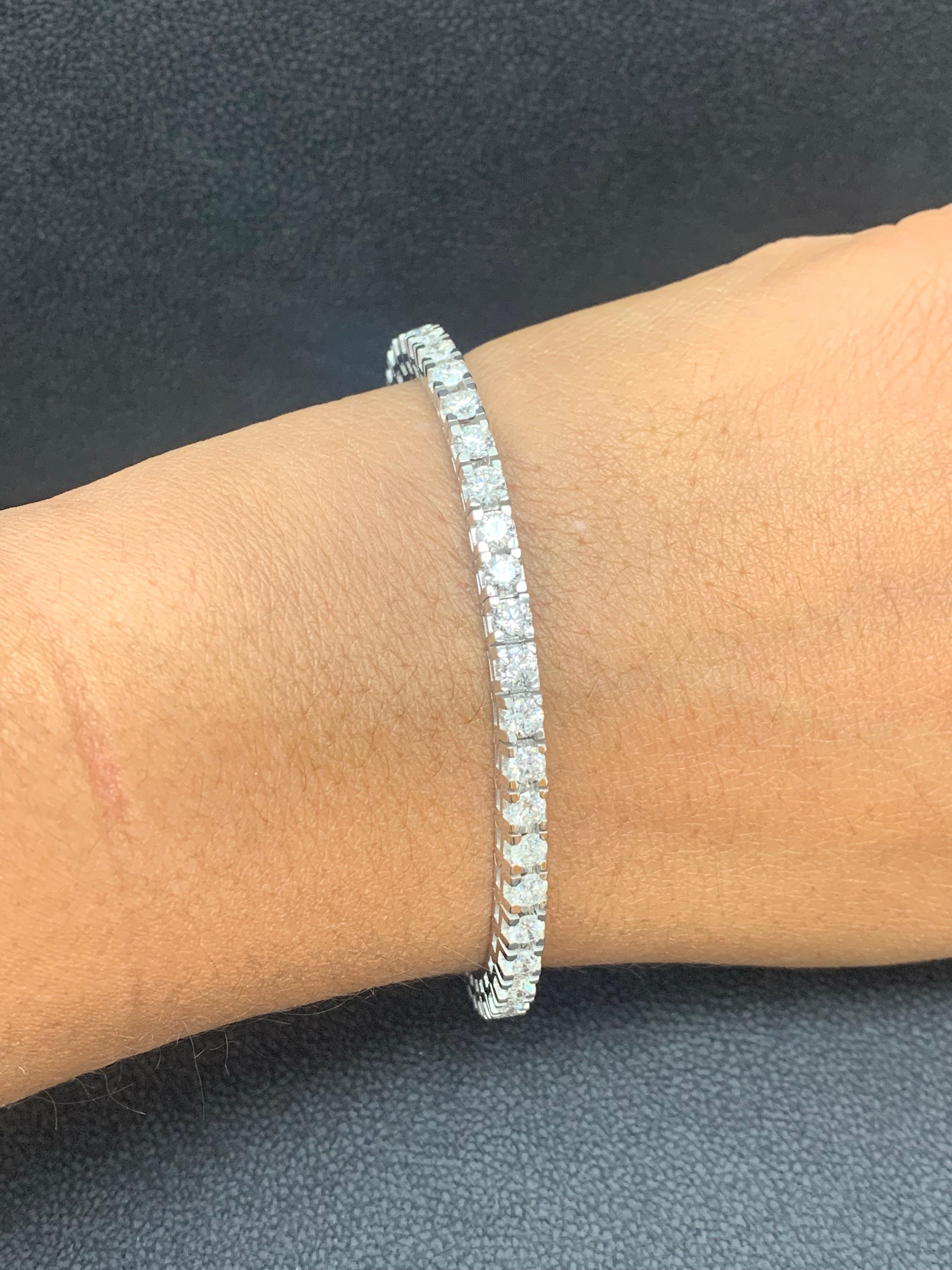 A classic tennis bracelet style showcasing a row of round brilliant diamonds, set in a polished 14k white gold mounting. 47 Diamonds weigh 6.02 carats total and are approximately GH color, SI1 clarity.

Style available in different price ranges.