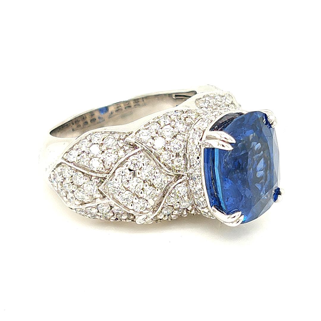 Introducing our truly extraordinary and remarkable Sapphire Ring that is bound to captivate even the most discerning jewelry enthusiasts. 

This exquisite piece boasts a majestic 6.02 Carat Sapphire of royal blue color, cut in a cushion shape.