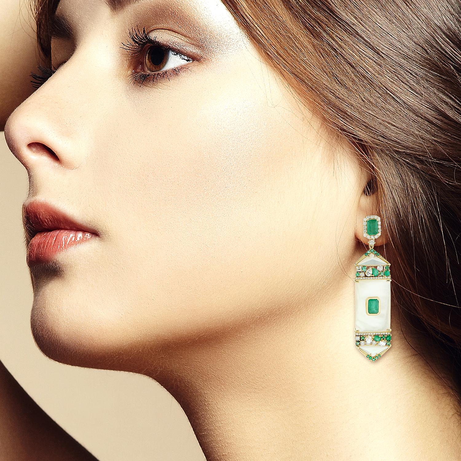 Cast from 14-karat gold, these stunning earrings are hand set with 6.02 carats Emerald, 22.4 carats mother of pearl and 1.52 carats of glimmering diamonds. 

FOLLOW  MEGHNA JEWELS storefront to view the latest collection & exclusive pieces.  Meghna