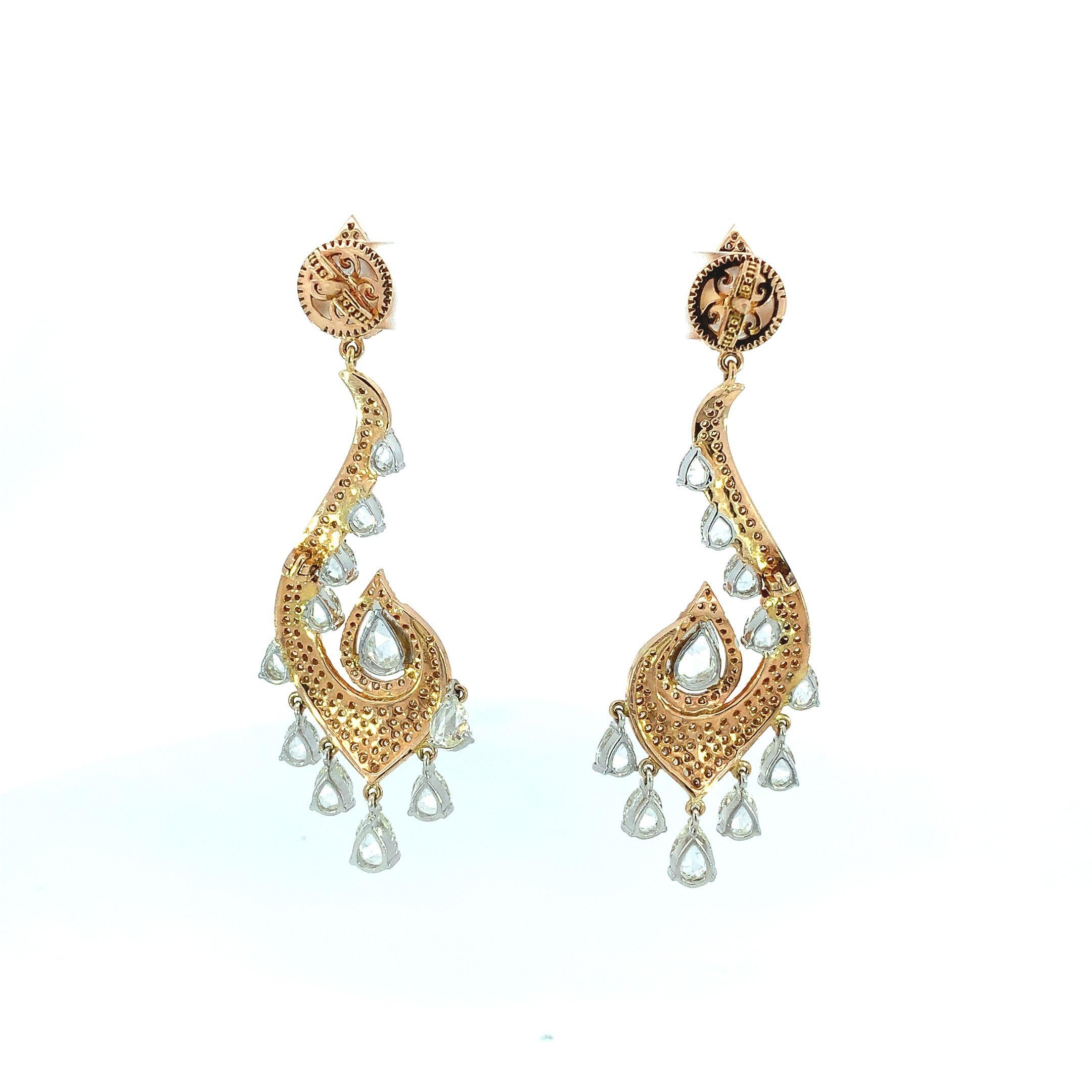 Step into a world of enchantment with these exquisite earrings. Boasting an intricate oriental paisley design that exudes elegance and allure, these earrings were crafted in lustrous 18K rose gold with a captivating swirl of intricate patterns