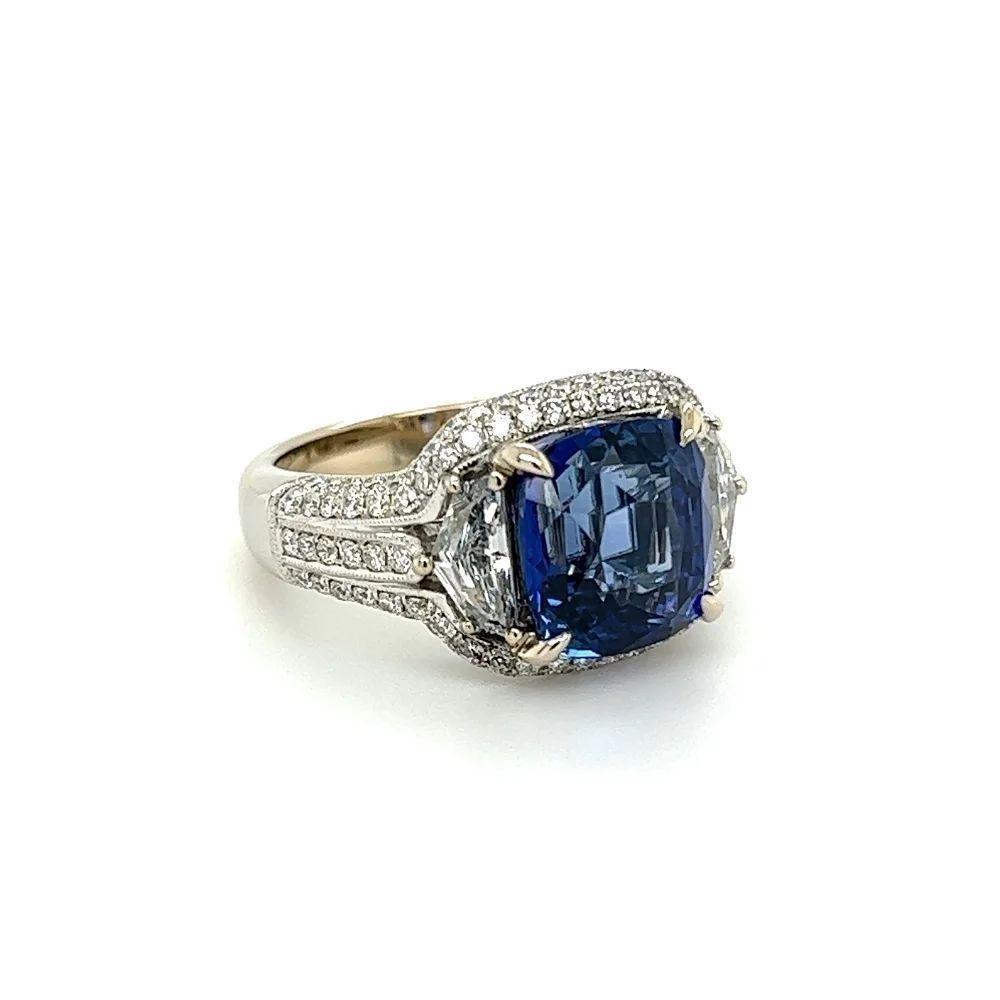 Simply Beautiful! Elegant and finely detailed Cushion-Cut Sapphire and Diamond Platinum Cocktail Ring. Centering a securely nestled Hand set 6.03 Carat Fabulous Cushion Sapphire surrounded by 2 Shield cut Diamonds approx. 0.85tcw and Round Brilliant