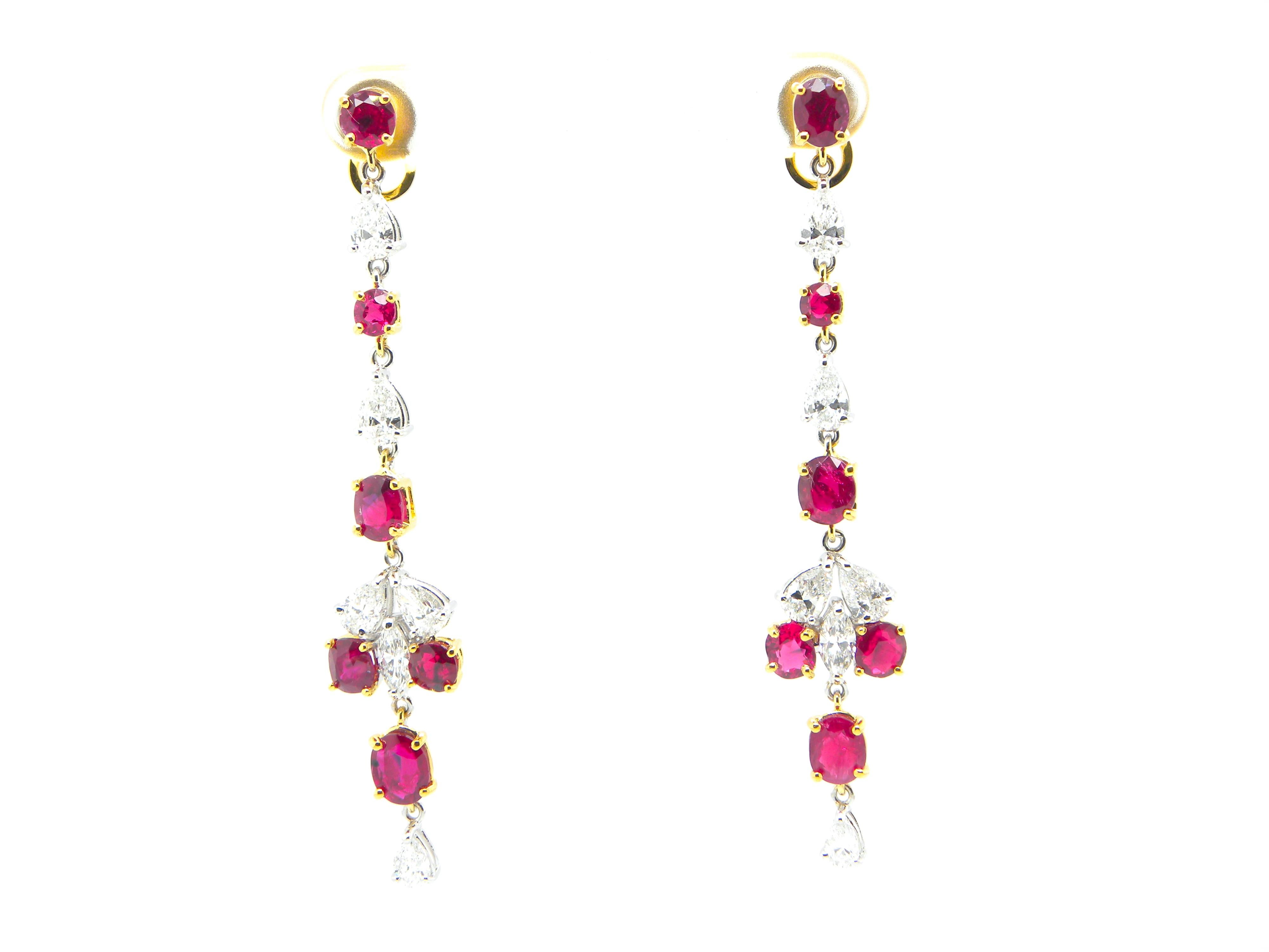 6.03 Carat GIA Certified Burma No Heat Pigeon's Blood Red Ruby and Diamond Gold Earrings:

A beautiful pair of earrings, it features twelve oval-cut and cushion-cut unheated Burmese pigeon's blood red rubies weighing 6.03 carat, embellished with