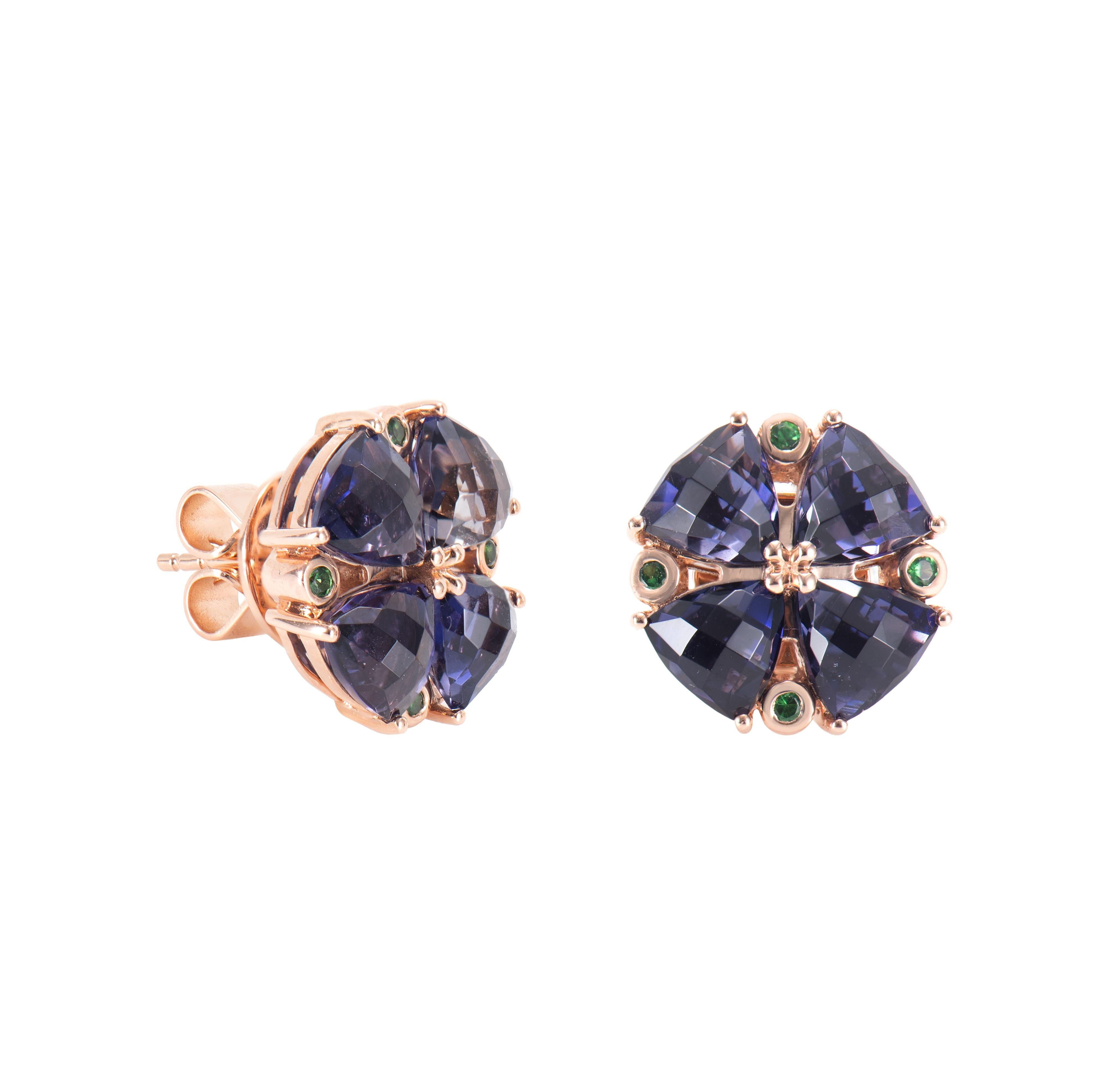 These are fancy iolite earrings in a trillion shape with purple hue. The stud earrings are elegant and can be worn for many occasions.

6.03 Carat Iolite Stud Earring in 18 Karat Rose Gold with Tsavorite.

Iolite: 6.03 carat, 5.50mm size, Trillion