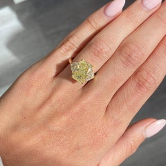 6.03 Carat Light Yellow Elongated Radiant Diamond Three Stone Ring