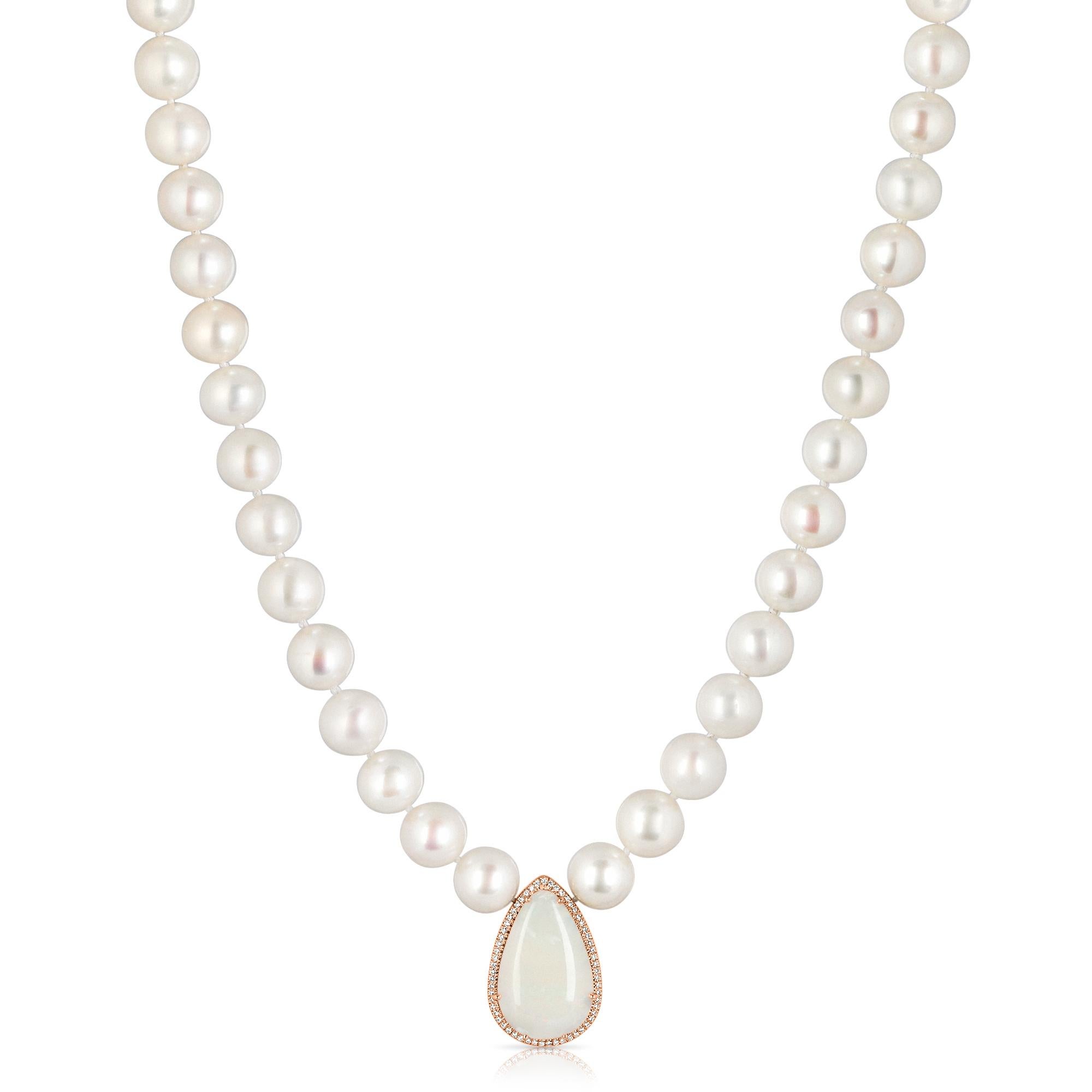 Amazing necklace set with 10 mm pearls, the main stone is a 6.03 carat pear shaped opal and brilliant round diamonds total weight 0.25 carat

