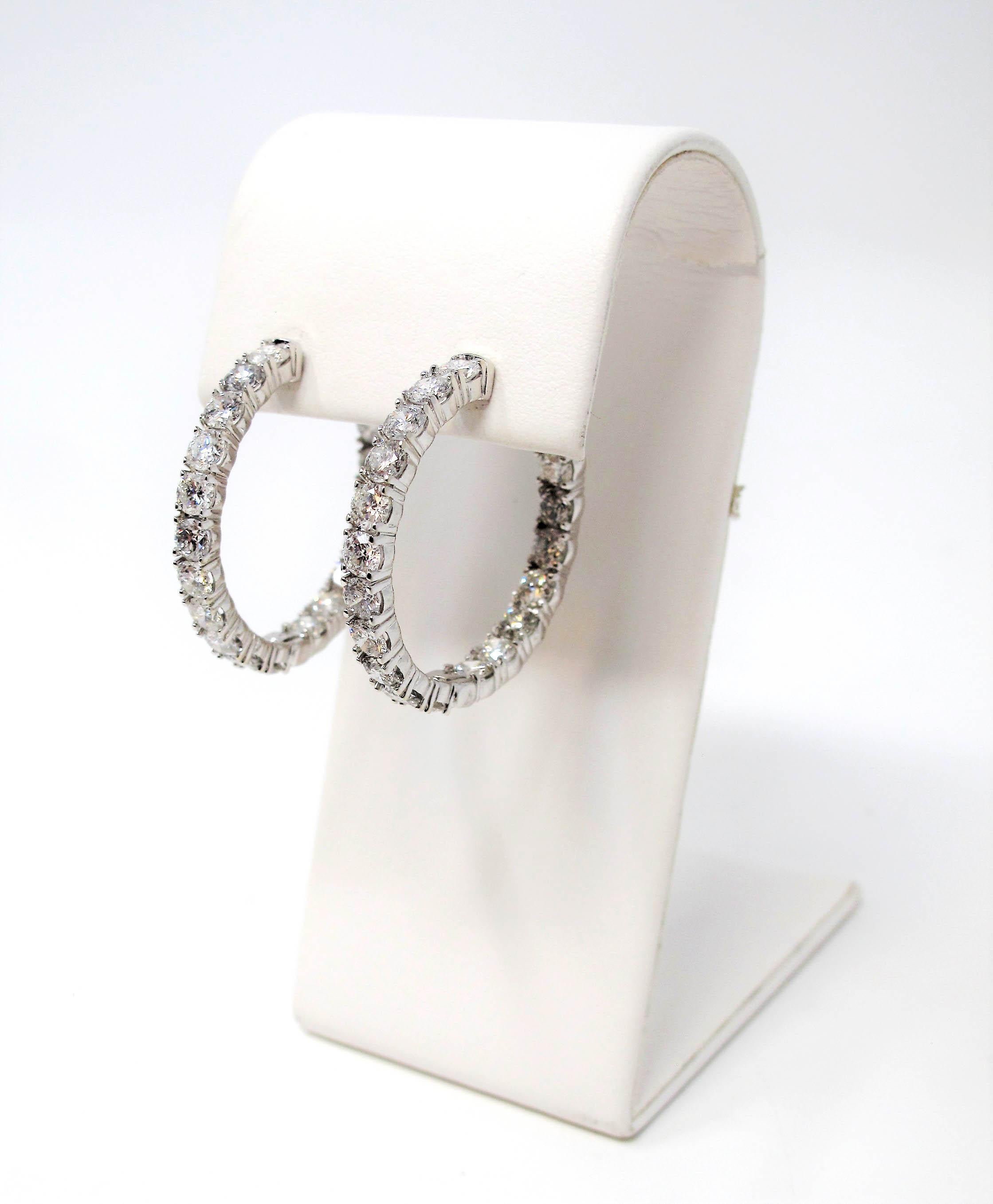 If you are looking for dazzling sparkle from every angle, these stunning diamond hoop earrings will not disappoint! Arranged in a unique inside/outside setting, the diamonds are positioned to catch the light from different angles. 

These gorgeous