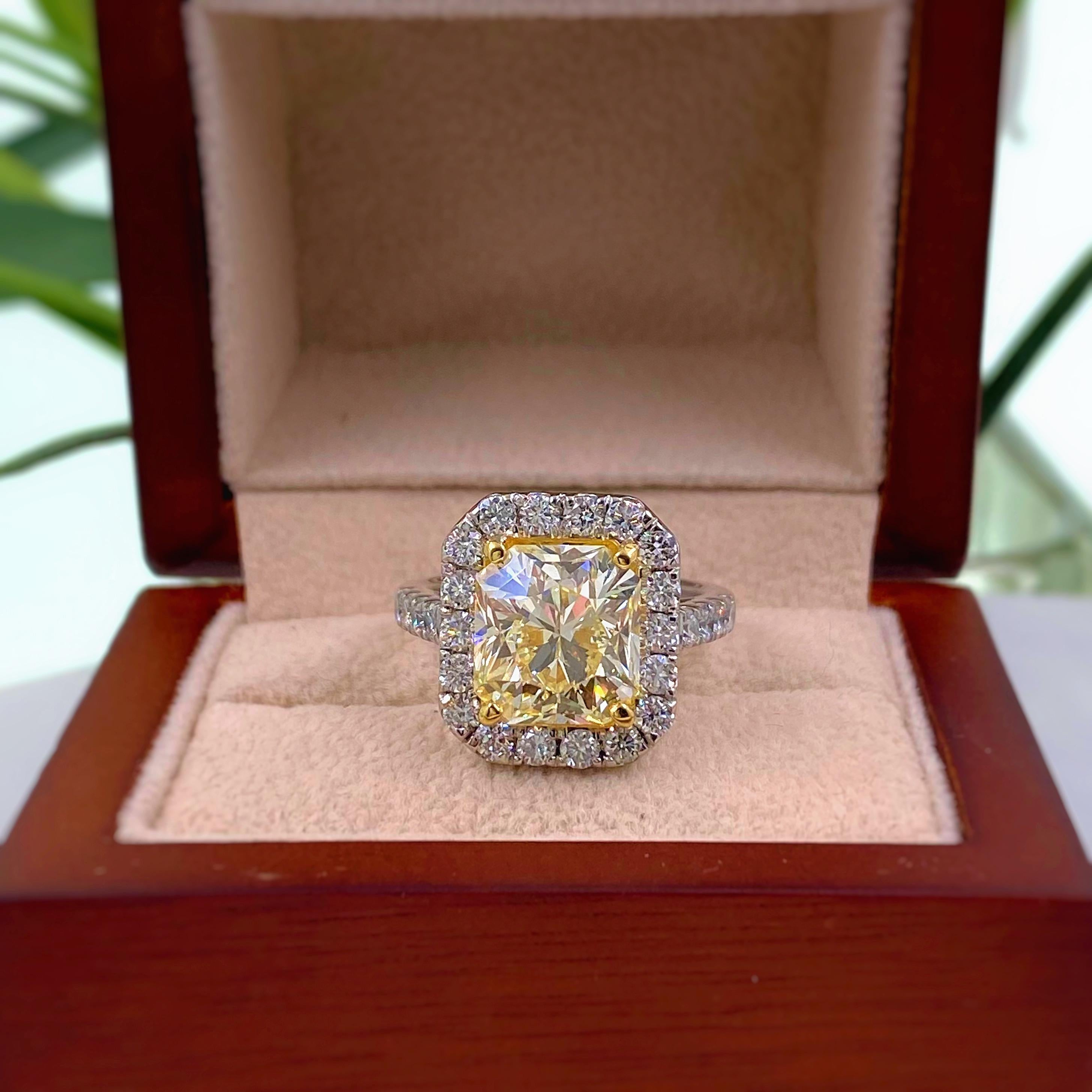 Fancy Radiant Diamond Ring

Style:  Diamond Halo Engagement Ring
GIA Report number:  2105767786
Metal:  Platinum & 18K Yellow Gold,  15.12 grams
Size / Measurements:  Ring Size 6.5
TCW:  6.03 Carats Total
Main Diamond:  5.03 Carats Radiant Cut