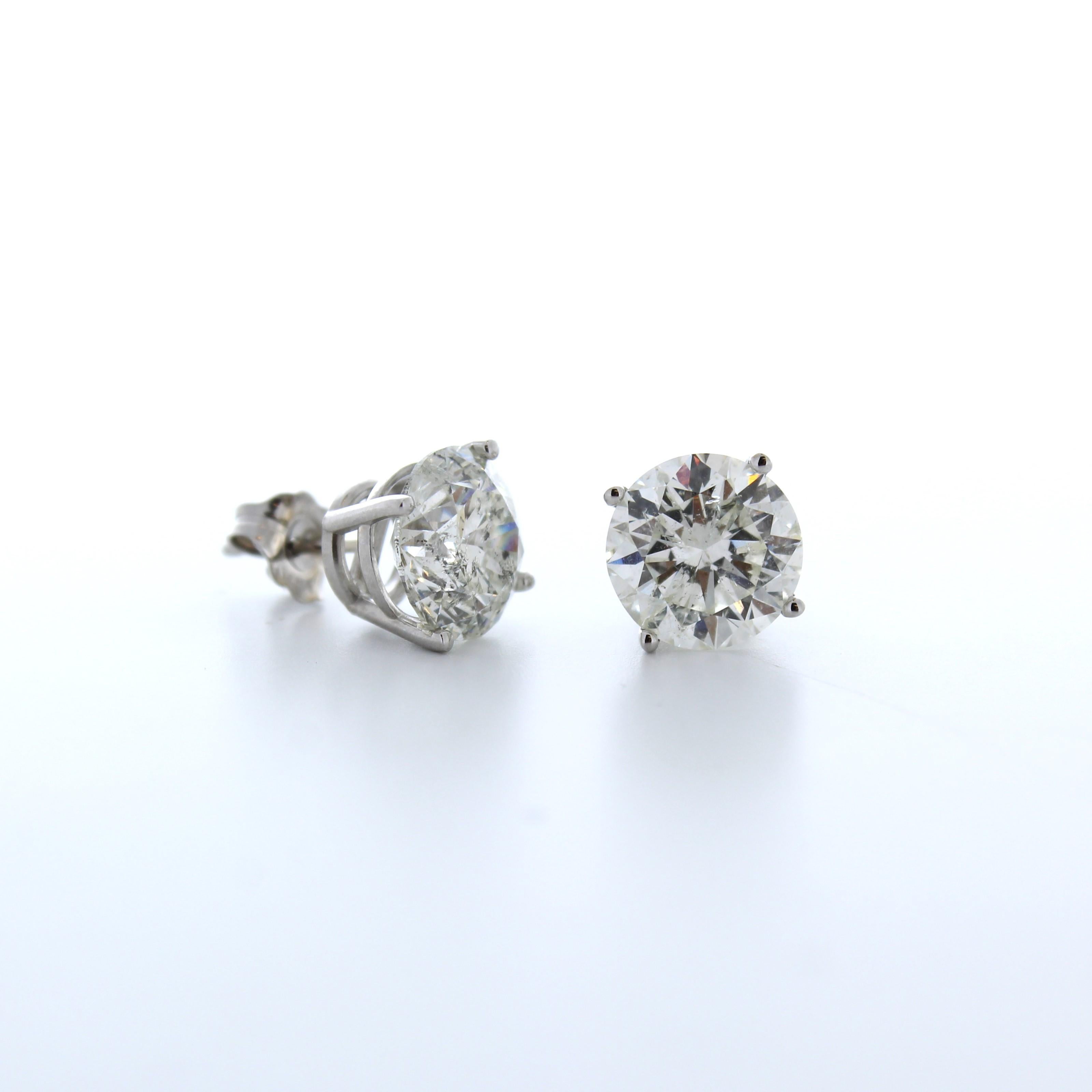 Introducing the pinnacle of elegance and luxury, these 6.03 Total Carat Weight EGL Certified Round Diamond Studs in 14k White Gold are the epitome of sophistication. Each stud showcases a mesmerizing round diamond with a captivating H-I color grade,